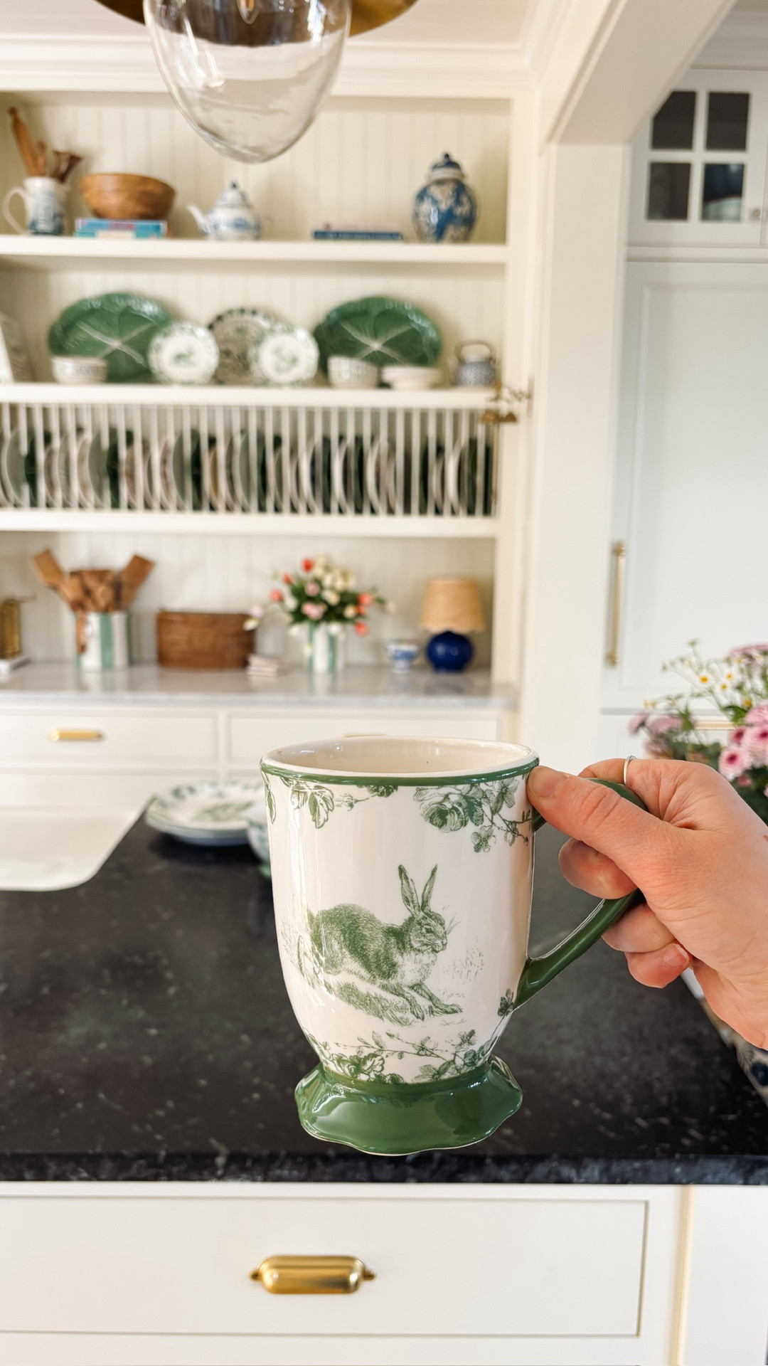 These green and white bunny dishes are one of my favorite finds this spring. 😍 Each piece has a different bunny design which makes them feel even more special. 
@Wayfair #wayfair #ad #wayfairpartner

The mugs are the coziest shape and size. Perfect to hold in your hand and I love the ruffled bottom so much. I know I’ll want to reach for these every morning this spring! 🐰 

I’ve been displaying a few on plate stands in the dish rack, and they’re just as lovely for everyday use as they are for styling and gatherings.

#LTKHome #LTKSeasonal #LTKdayinmylife