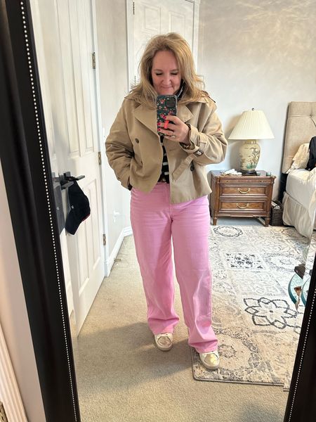 I’ll be posting ways to wear these pink pants tomorrow. But wearing them today! And all the layers since it’s turned cold. 

My crop trenchcoat was the perfect jacket to bring on this trip since it’s 30° cooler today than it was over the weekend. I’m in a large but linking several options since mine is sold out at h&m. 
Jeans size 12 reg. Yup. They’re long and I didn’t bring a platform sneaker so just wearing them like. 

Cropped sweater size XL. 20% off code NANETTESP24

striped button down size large  

#LTKover40 #LTKmidsize #LTKtravel