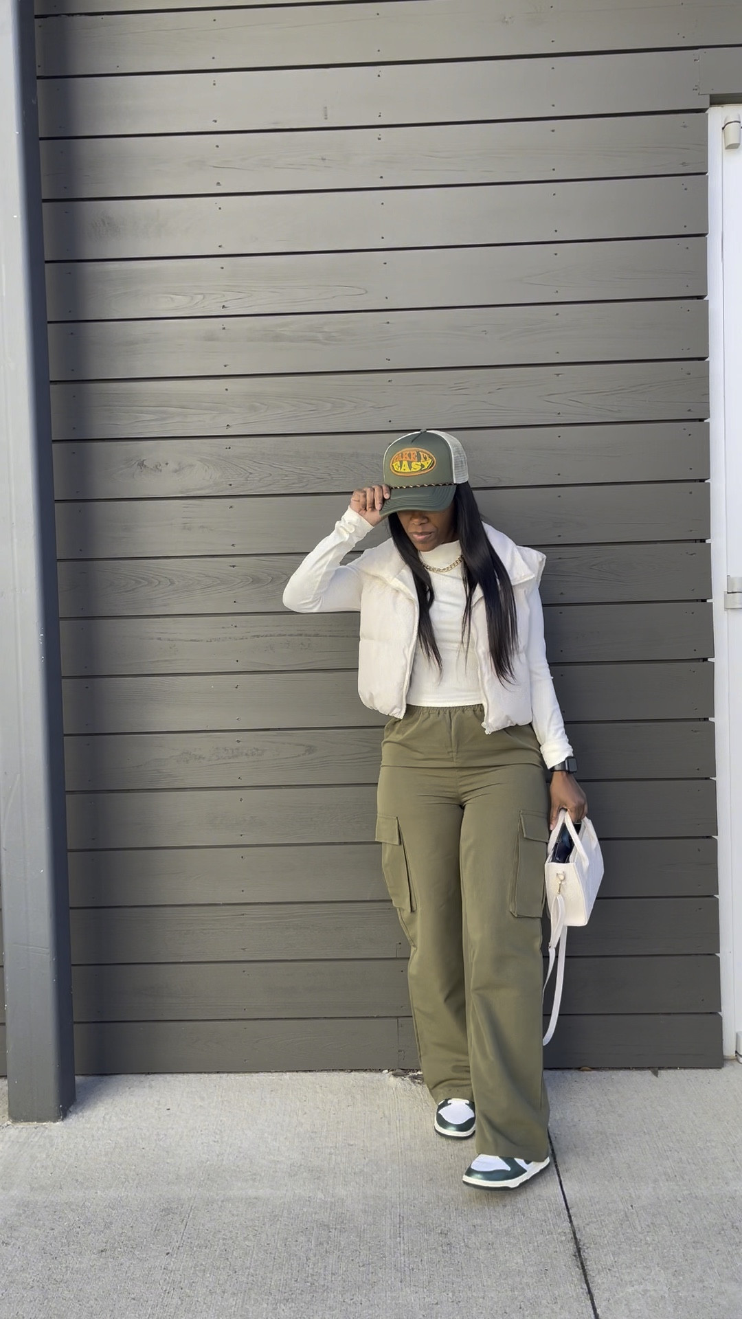 Casual outfit idea. I’m wearing a size small in the long sleeve crop top, puffer vest, and cargo pants. I styled this causal outfit with a trucker hat, crossbody bag, and sneakers for a street style vibe! 

#LTKshoecrush #LTKfindsunder50 #LTKstyletip
