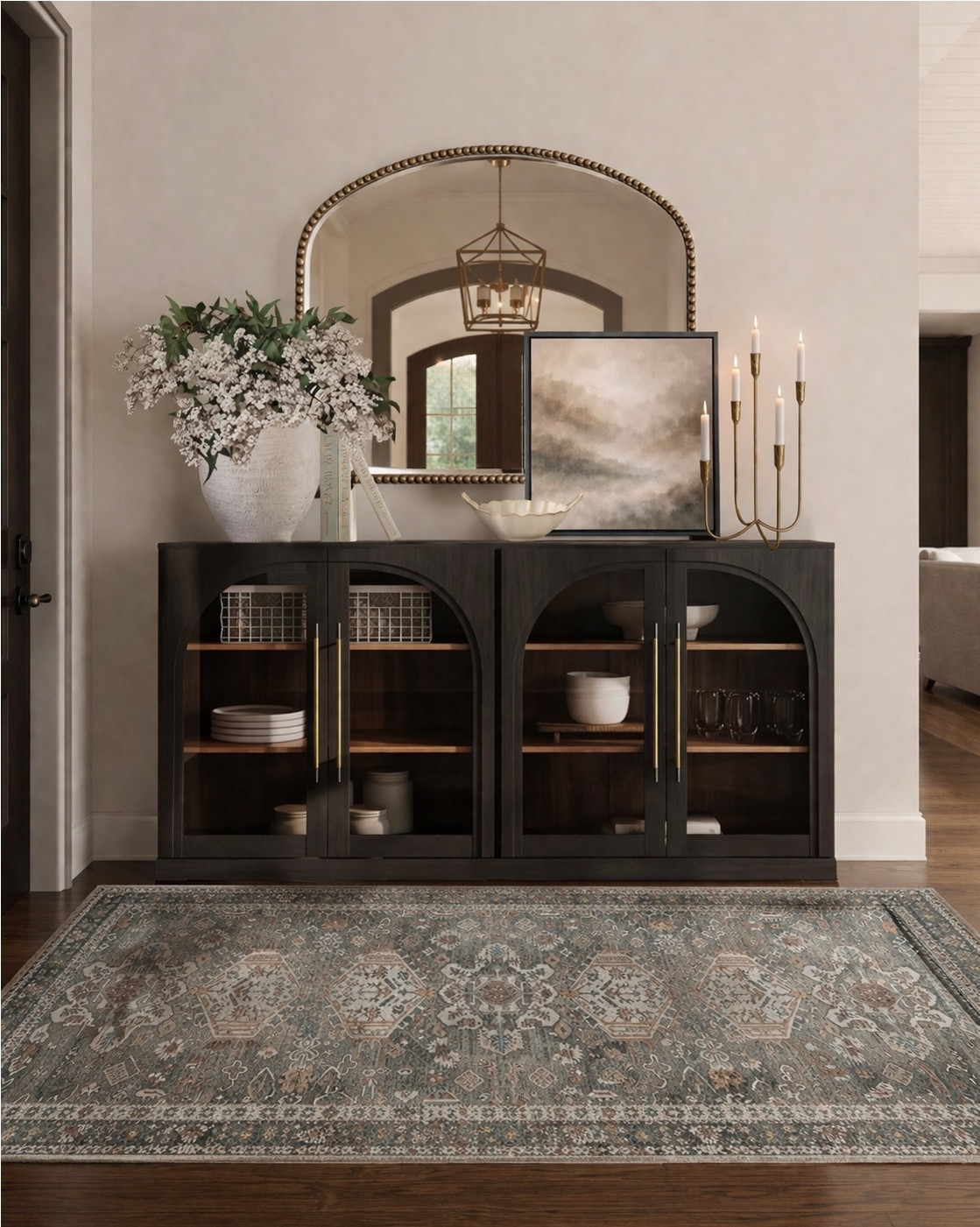 Neutral Console Table Styling with Arched Mirror + Amazon Home Finds

Follow @farmtotablecreations on Instagram for more

This is one of my favorite ways to create a high-end look without overcomplicating things 🤍 The arched mirror adds height and softness, while the layered artwork, florals, and warm brass accents bring everything together. The cabinet is such a beautiful statement piece with the rich wood tones and glass detailing—perfect for styling and storage. And that rug ties it all in with the prettiest muted pattern 🙌🏼

Everything here gives that elevated, designer feel… but it’s all Amazon finds 👏🏼

#consoletable #homedecor #mirror #area rug #candles #cabinet #livingroomdecor #neutraldecor #amazonhome #homefinds

#LTKSaleAlert #LTKHome
