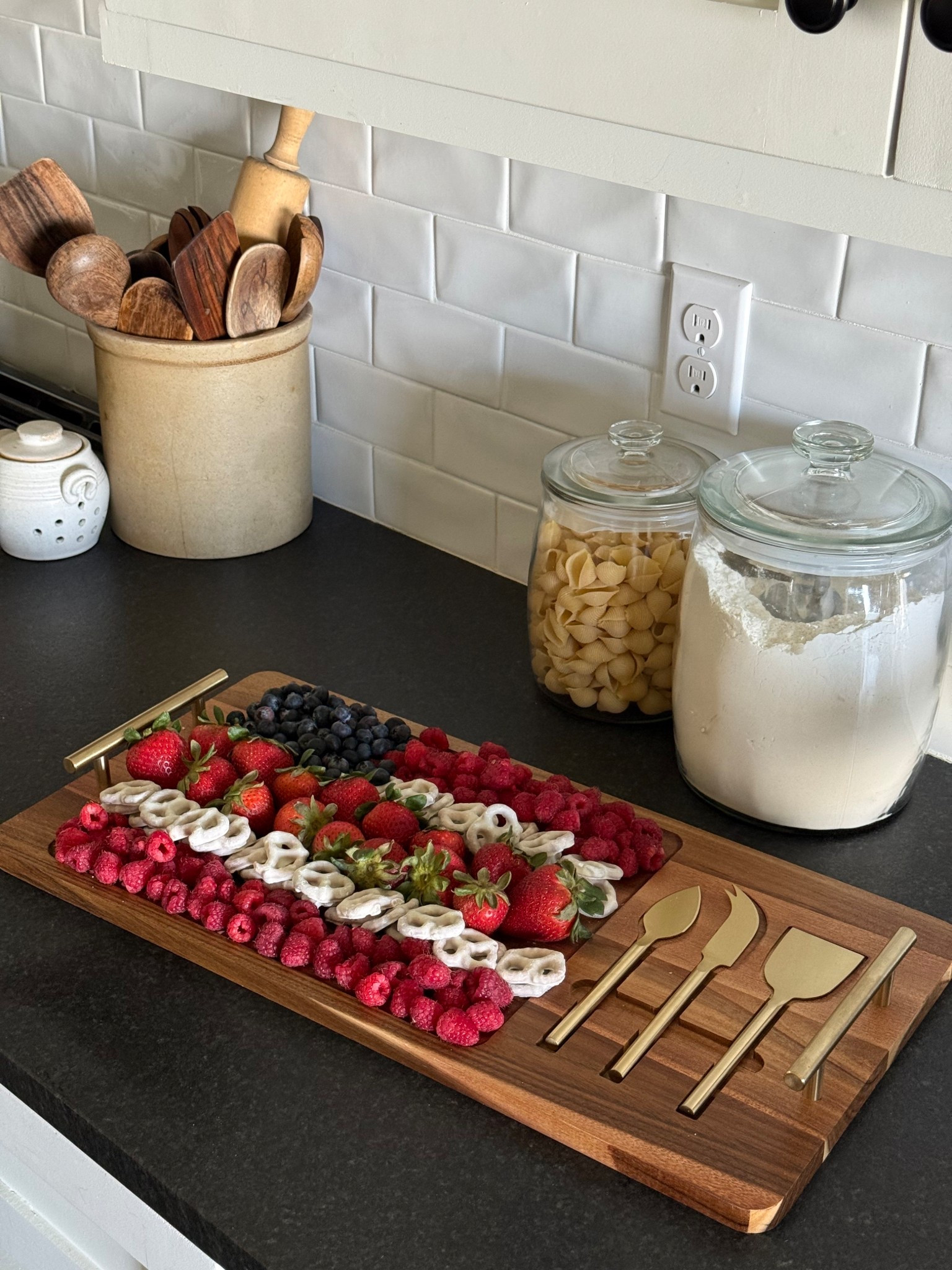 In love with this charcuterie, board with tools included and handles for easy carrying around for all the summer hosting that is fastly approaching! I did this fun Americana style board with fruits and chocolate covered pretzels in the shape of an American flag! So fun and easy!

#LTKSeasonal #LTKHome