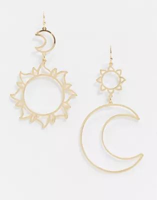 ASOS DESIGN earrings with moon and sun cut out drop in gold tone | ASOS | ASOS (Global)