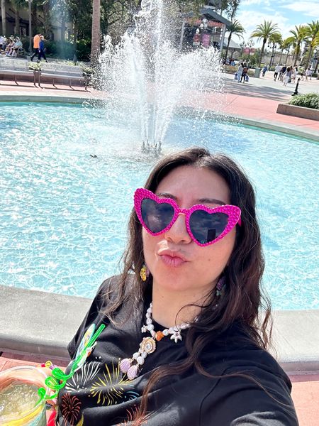Living it up at Disney Springs! #disneyworld #disneyvacation #disneysprings #disneyspringsoutfit #littlemermaid #supersmalls #heartsunglasses #pinksunglasses #birthdayatdisneyworld 