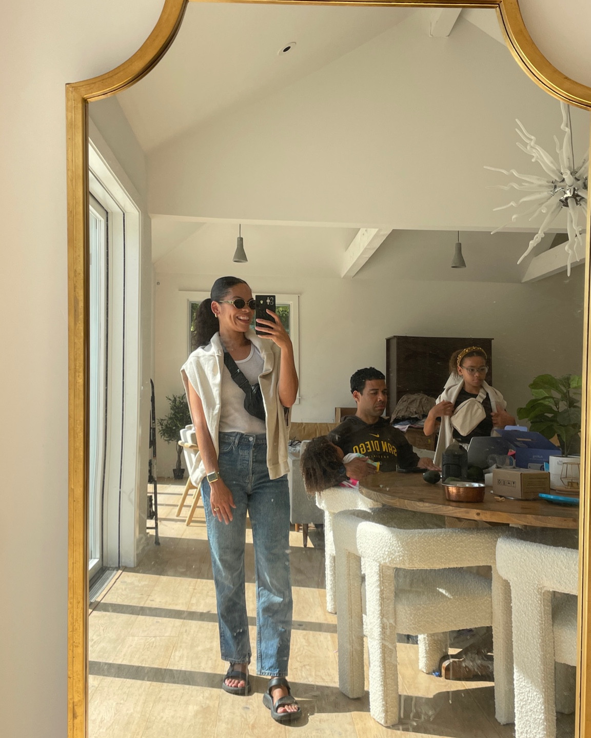 Easy summer uniform - tank, jeans, and sweatshirt over the shoulders for when the sun goes down. Love these sandals so much they are my go to’s! Everything fits TTS