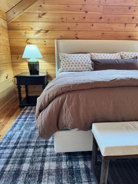 A glimpse at my favorite bedroom at the mountain house. The moody plaid rug with the block print & toffee bedding combo is such a good mix. #mountainhouse #brownbedding #belgianlinenbedding #blockprintbedding

#LTKhome