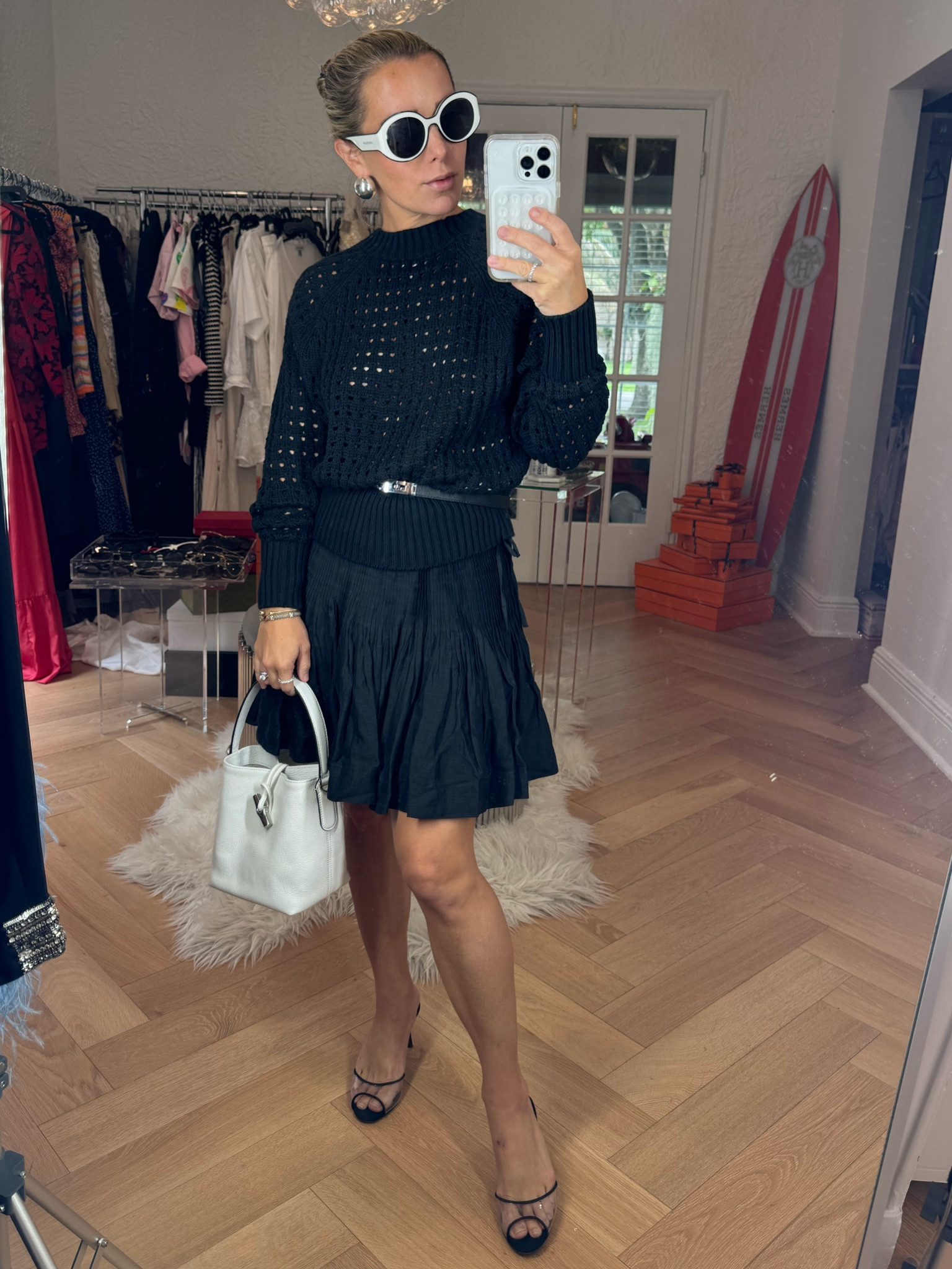 A chic all black summer outfit! 

Perfect to wear for a more casual event, lunch date, date night, or vacation outfit, including a European summer outfit idea 

Black skirt, black belt, black knit sweater, white handbag, white and black sunglasses 

#LTKStyleTip #LTKTravel #LTKItBag