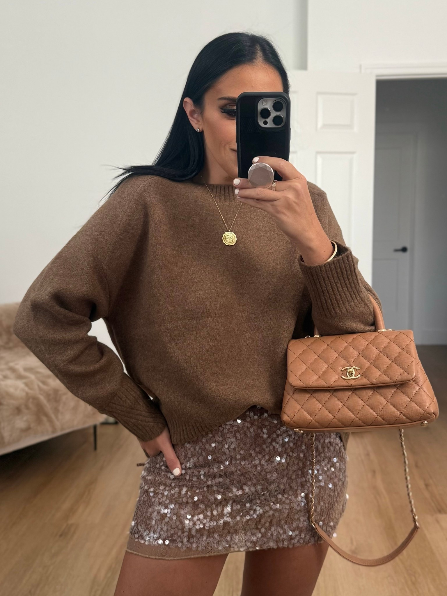 Soft feel knit jumper wearing size small. sequin mini skirt wearing size medium. 
