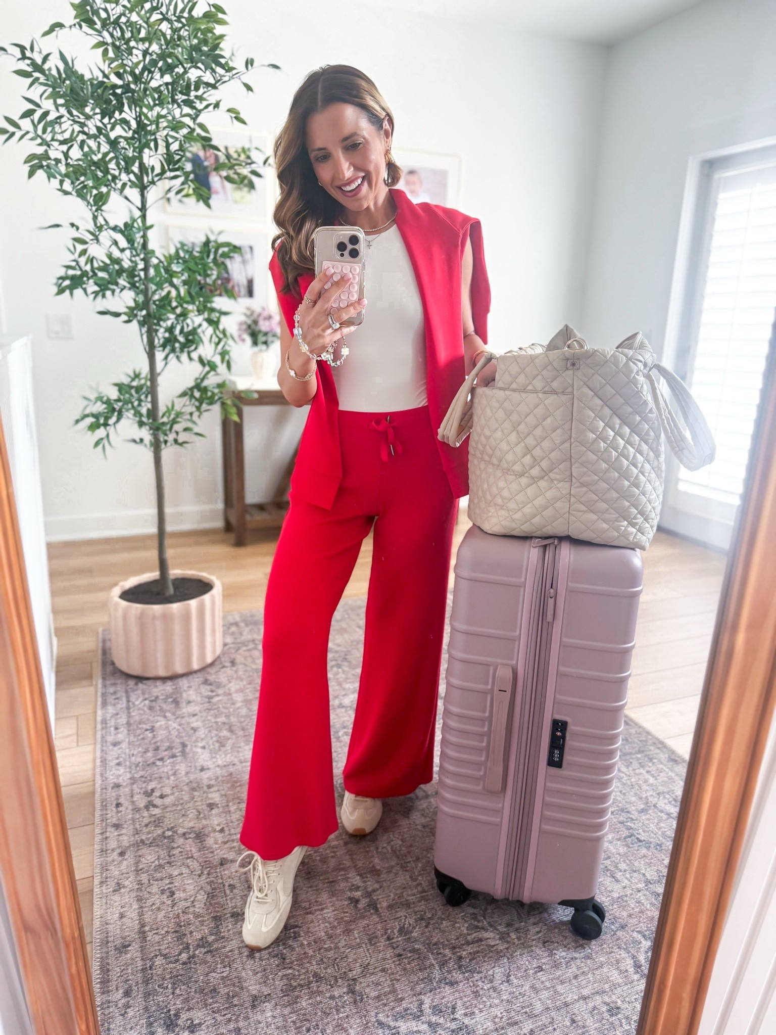 My travel outfit of the day! Airport outfit. Matching pant set. XS petite in pants and XS in top. SO excited to wear this matching set to the airport soon! These are the best sets for travel and hold up so well over time! I love that the pants come in length options and the red is just gorgeous! Code LISAMARIEXSPANX for 15% off first purchase + free shipping, excluding sales

#LTKootd #LTKTravel #LTKPetite