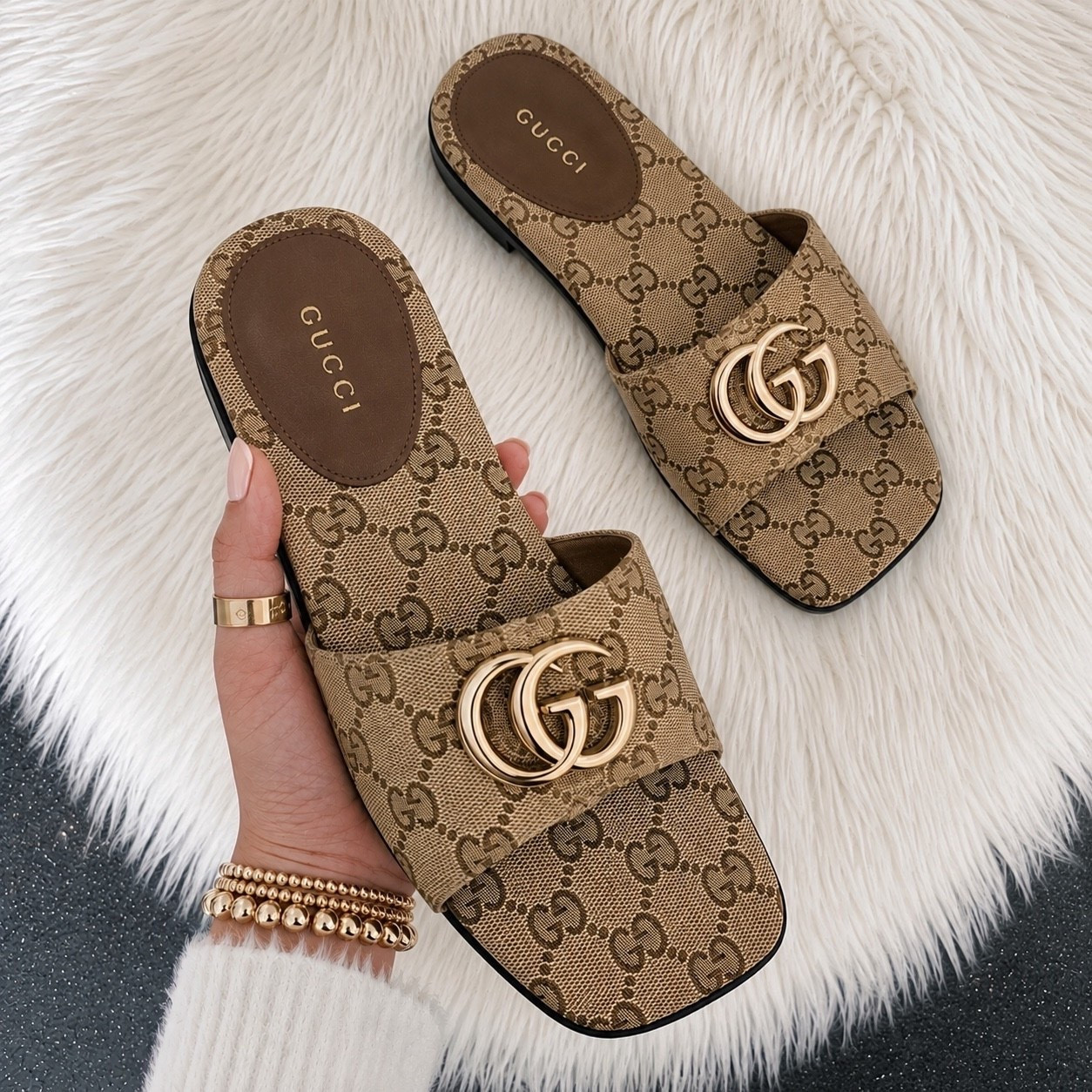 These Gucci Double G slides are the perfect mix of effortless luxury and everyday chic. The iconic GG canvas and gold Double G hardware make them such a timeless pair that instantly elevates any outfit, whether you’re dressing up denim or throwing them on with a summer dress. They’re comfortable, classic, and definitely a closet staple you’ll reach for again and again.

Sizing: I wear a US 8.5 and take a Gucci size 39.5 in these. They fit me perfectly, so I’d recommend ordering your usual Gucci size.