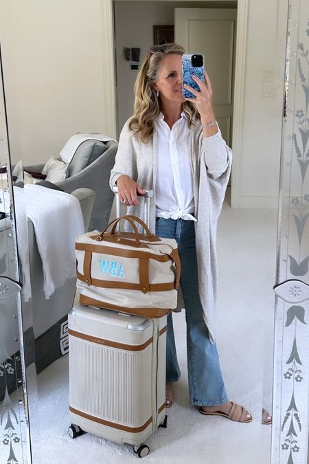 Comfortable travel look! 
Easy linen button up 
Best jeans for travel 
Light wash Nomad cropped boot cut from Mersea
Cocoon cardigan from Mersea 
Paravel aviator carry on 
Paravel monogrammed tote 


#LTKstyletip #LTKtravel #LTKover40