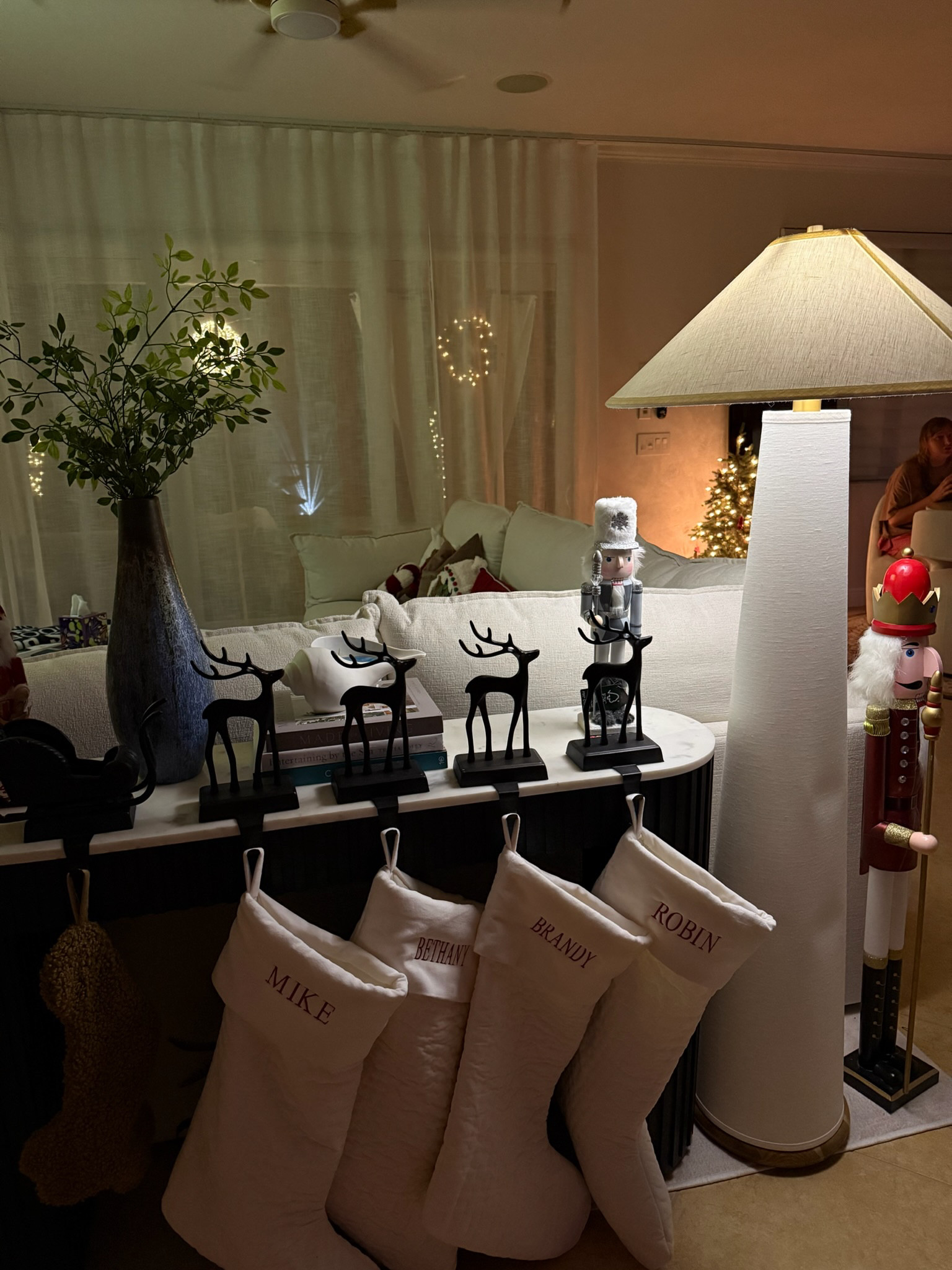 cozy living room decor for the holidays, holiday decor for the living room, reindeer and Santa's sleigh stocking holders 

 #LTKHoliday #LTKSeasonal #LTKHome