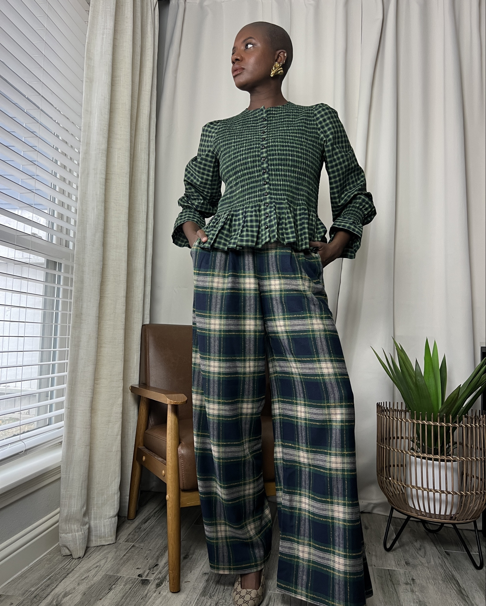 Find winter outfit that involves pattern play. Plaid high-rise wide leg pants and plum plaid top with bell sleeves. My lipstick is urban decay. Great work wear outfit! 

#LTKWorkwear #LTKNYFW