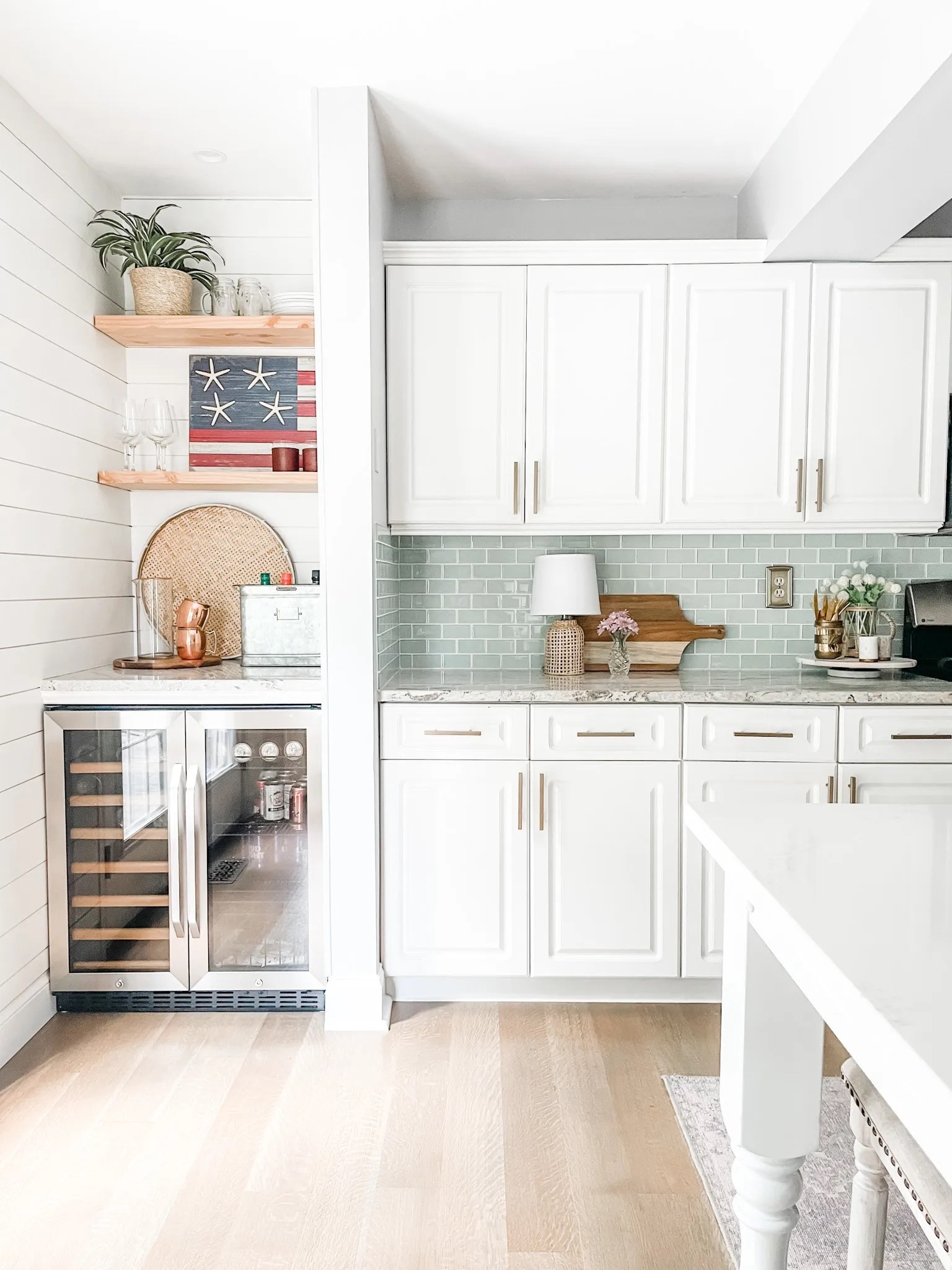 Kitchen decor, built-in wine and beverage refrigerator, wine fridge, beverage station, beverage bar, coastal kitchen, champagne bronze bar drawer pull, kitchen hardware, glass mosaic tile, lazy Susan kitchen counter decor, flat wicker basket, marble salt & pepper shakers.

#LTKFind #LTKhome