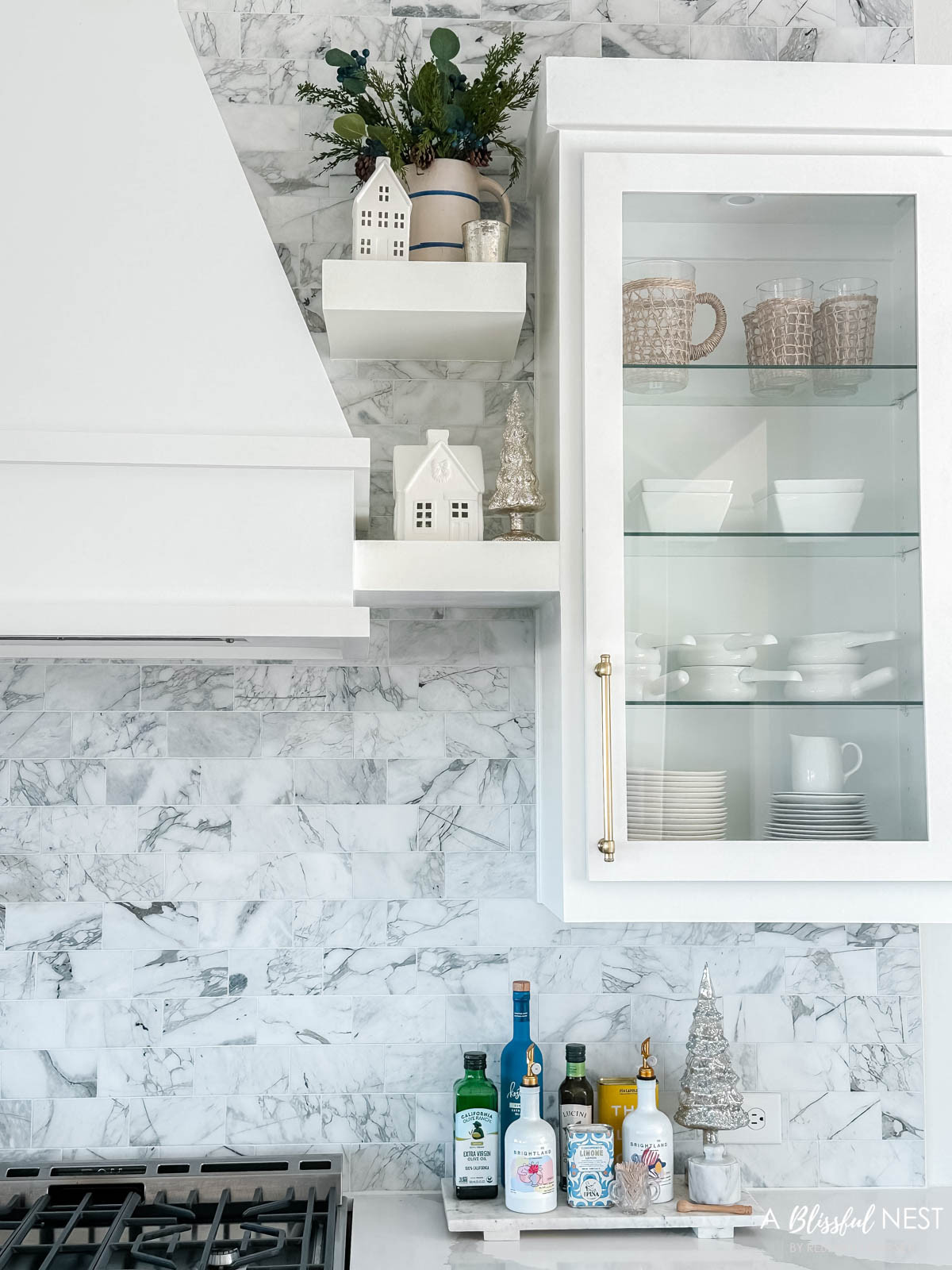 Clean, cozy, and dressed up with just the right hint of Christmas. Shop the decor here.
illuminated mercury Christmas trees, blueberry greenery pick, Christmas village houses 

 #LTKHoliday #LTKSeasonal #LTKHome