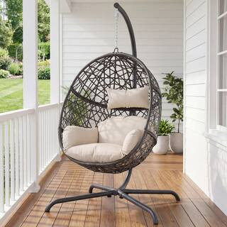 Outdoor Foldable Brown Wicker Egg Porch Swing Chair with Steel Stand and Beige Cushion for Patio | The Home Depot