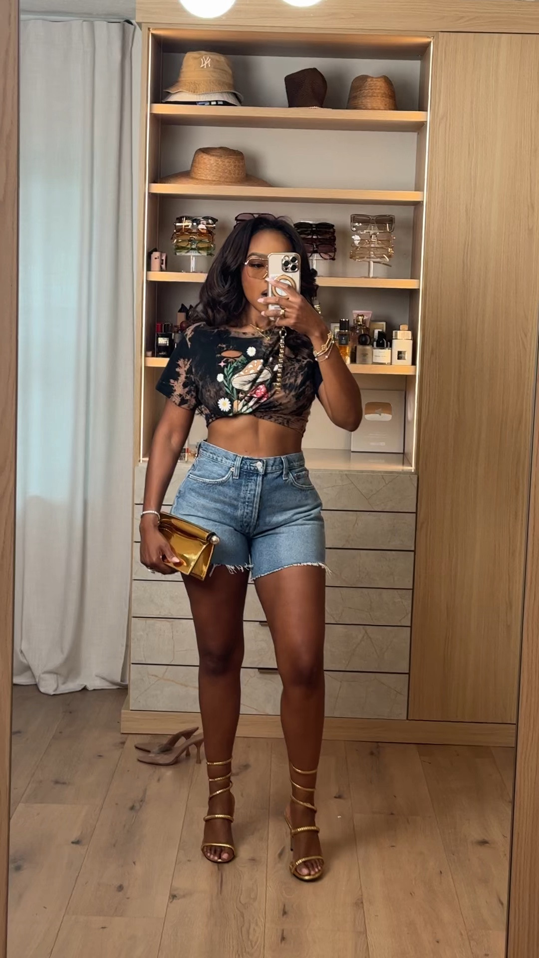 Hi Babes! 🖤✨

This outfit is giving cool-girl energy! The graphic cropped tee, classic denim shorts, and gold accessories make it the perfect look when you want to keep it casual but still turn heads.

Fit Details:
• Exact graphic crop tee
• Exact denim shorts
• True to size
• High-rise shorts with a flattering fit
• Styled with gold heels and a metallic clutch for an elevated touch

Where to wear:
• Concerts
• Girls' night out
• Weekend brunch
• Vacation exploring
• Summer festivals
• Casual dinner dates

Everything is linked below!

xx, Kira | IG: KirasFashionFinds

Measurements:
Kira: 5'4" | Size Small | 140 lbs