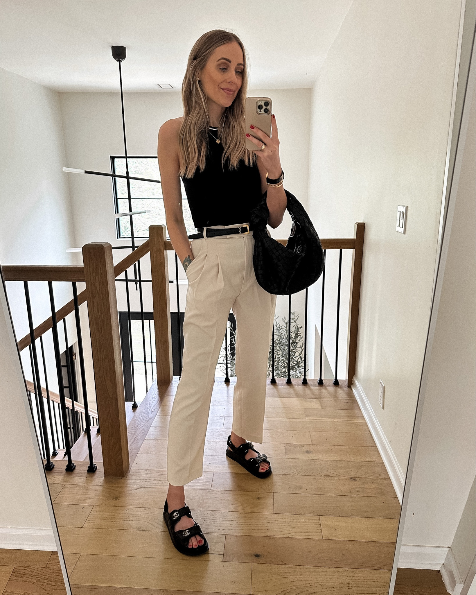 Fashion Jackson wearing black tank (small) beige trousers (small) Chanel dad sandals, black bottega handbag #fashionjackson #summeroutfit 

#LTKitbag #LTKunder100 #LTKstyletip