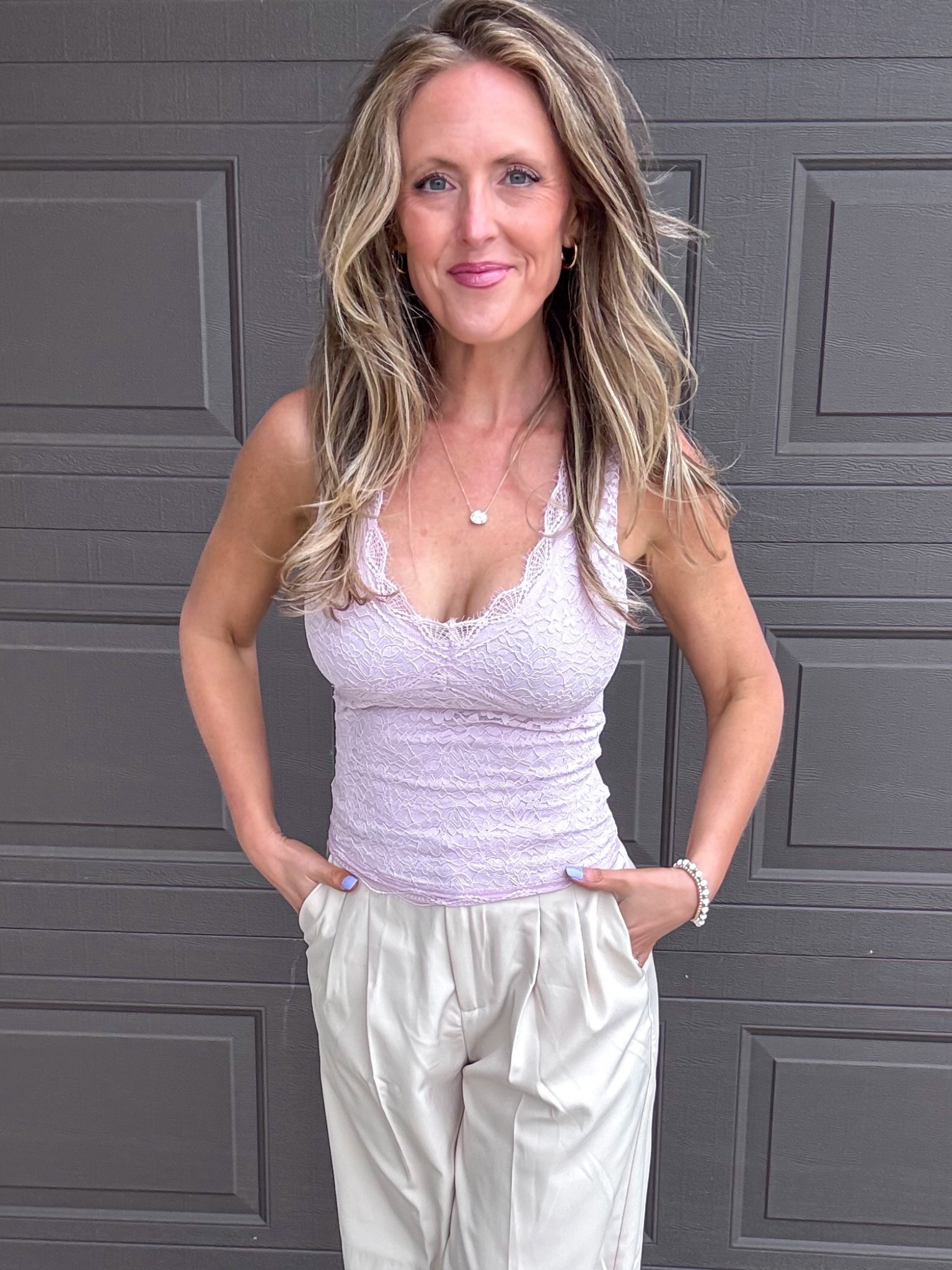 This lavender lace top is so, so pretty! 💜 Perfect worn with trousers as shown here and denim or a skirt too! Wearing an xsmall.

As an Amazon Influencer I earn commission on qualifying purchases.

Lace tank top, lavender top, purple spring top, spring tops, spring fashion 2026, date night top, mom style 

#LTKootd #LTKOver40 #LTKMidsize