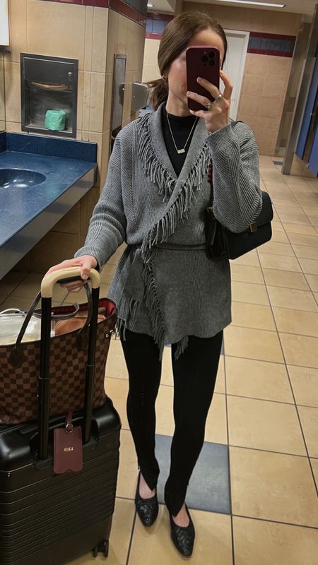 Travel look
Grey fringe cardigan splendid 
Black Toteme side zip leggings
Black woven ballet flats loeffler Randall 
Beis rolling carry on bag

#LTKshoecrush #LTKstyletip #LTKtravel