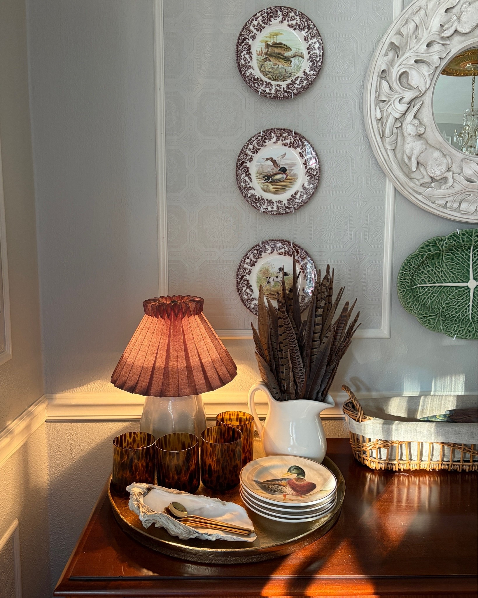 As summer transitions to fall, I’m slowly switching out my summer decor for pieces that are reminiscent of gathering and autumn. Feathers, ducks, and my favorite serving pieces come together for this vignette on my dining room buffet.

#LTKHome