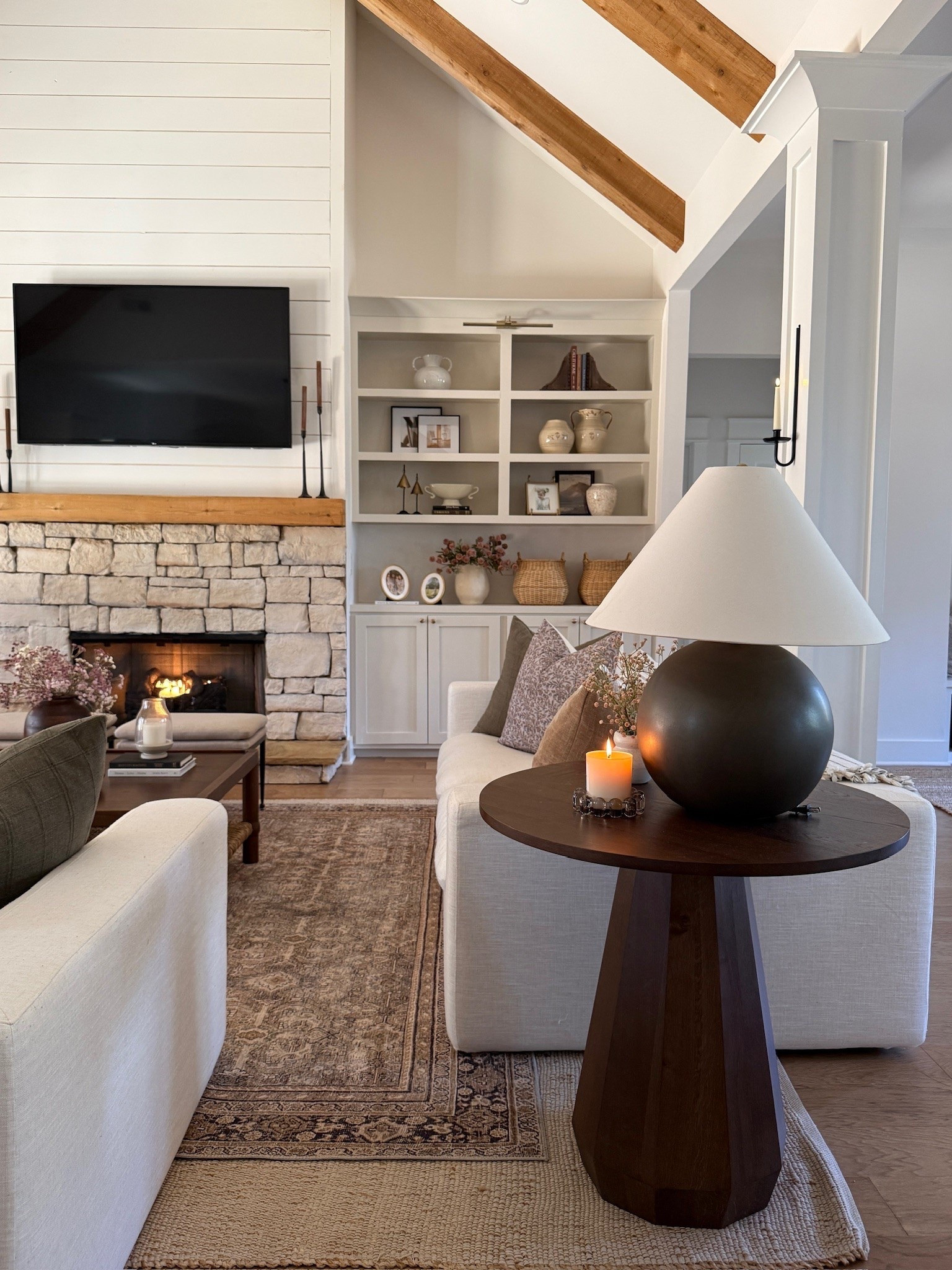 Our cozy living room 🤎 It’s a timeless living room with coziness and warmth, no matter the season! Love the mix of wood tones, textures and soft colors to create a collected and inviting space! Plus, our stone fireplace will always be a favorite.

#LTKHome #LTKSeasonal
