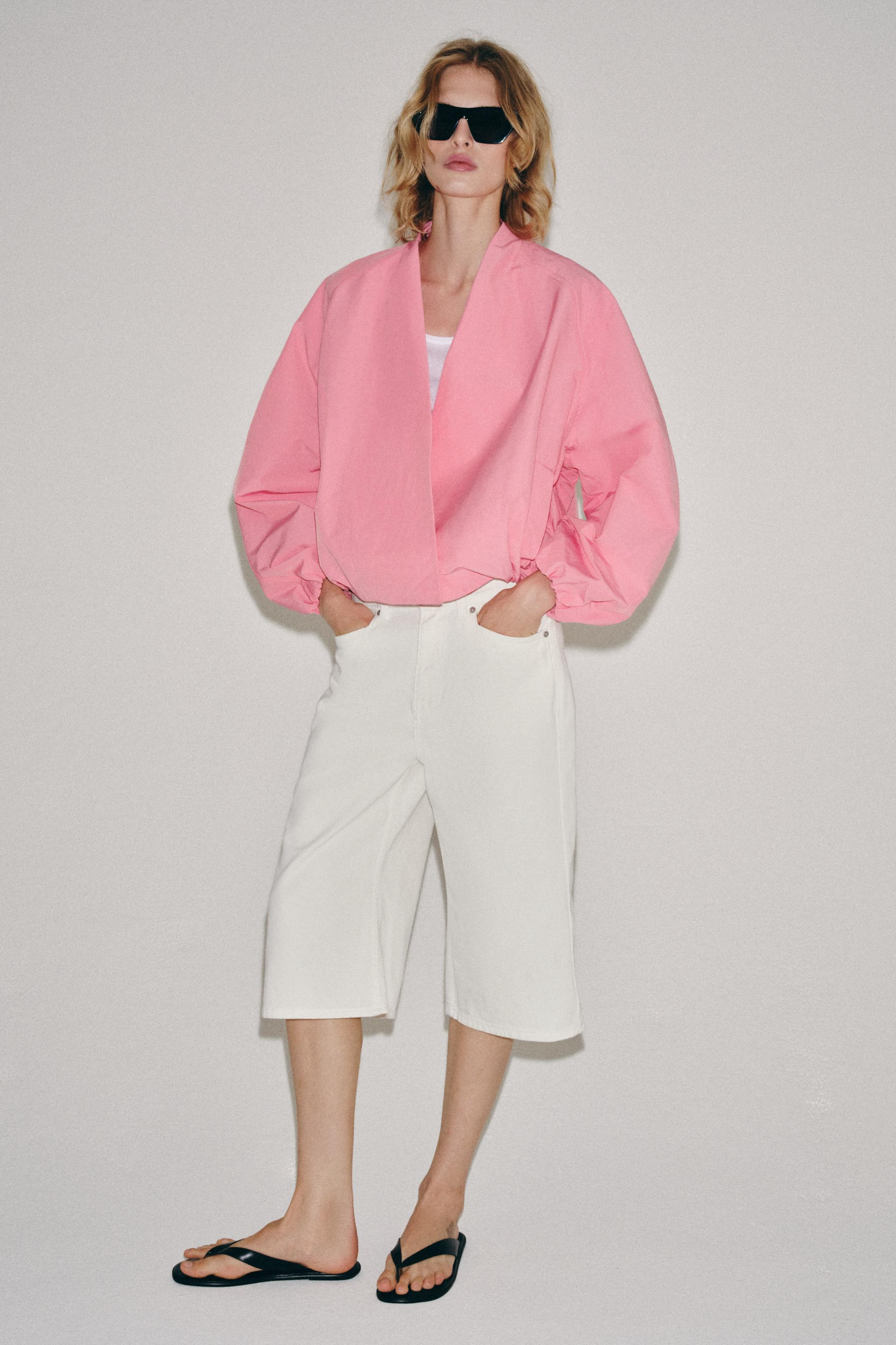 DescriptionColorContentsMeasurementsZARA WOMAN COLLECTIONBomber jacket with a V-neck and long puf... | Zara US