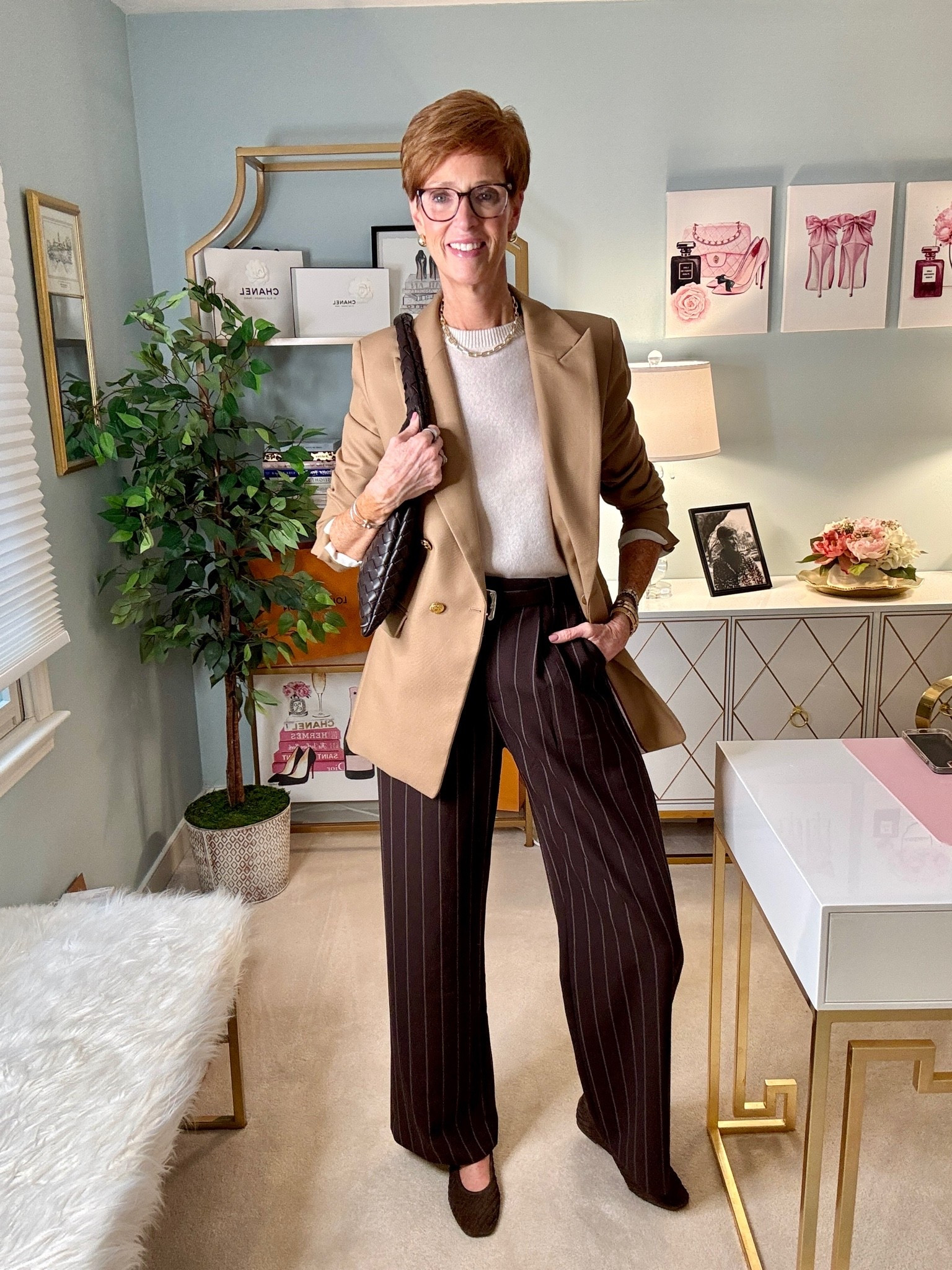 Classic style doesn't have to mean boring or dated. And this outfit is exactly why.
Pinterest Inspired Outfit #35 is all about combining timeless wardrobe staples in a way that feels modern, polished, and wearable.

Comment PINTEREST  and I’ll send everything over

A cream cashmere crewneck sweater, tailored camel blazer, brown pinstripe wide-leg trousers, and brown suede woven flats. Four classic pieces that work beautifully together without feeling overly dressed up.

At 56 and 6'1", I'm always looking for outfit combinations that feel sophisticated, flattering, and comfortable enough for real life. This is the kind of fall outfit I'd wear to lunch, a meeting, or anywhere I want to look pulled together without trying too hard.

The brown pinstripes are what make this outfit for me. They add just enough interest to a classic neutral combination.

Would you wear this outfit with flats, or would you add heels?

SAVE this for your next fall outfit inspiration, SHARE it with a friend who loves classic style, and FOLLOW @atalldrinkofstyle for more timeless outfit ideas for women over 40, including tall-friendly fashion.

Outfit details are linked in my ShopMy and in stories.
#ClassicStyleOver40 #FallOutfitIdeas #TallWomenStyle