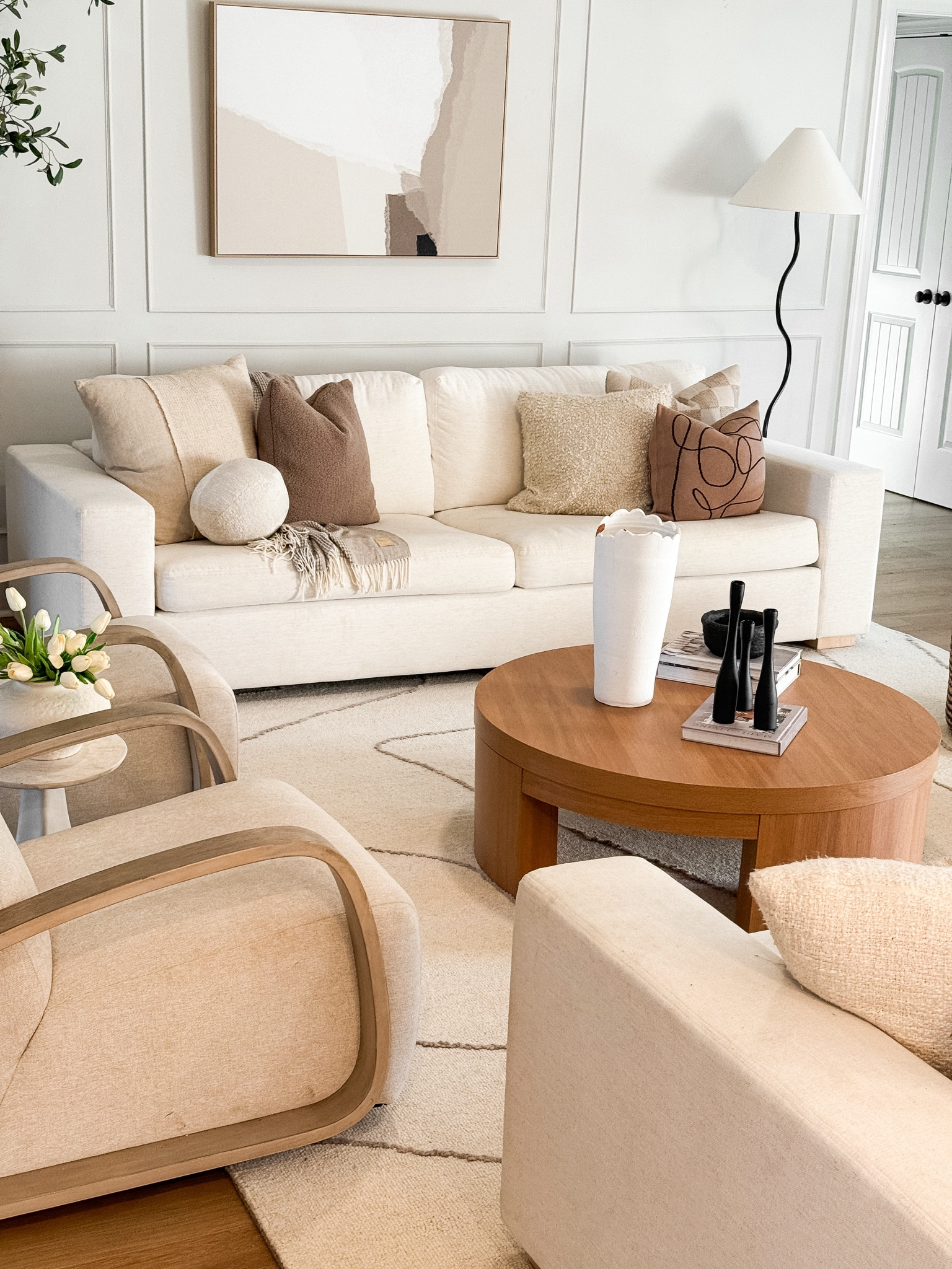 Organic modern living room

Swivel chairs
Affordable coffee table
Natural wood coffee table
Walmart coffee table
White couches
Kid friendly couches
Throw pillow combination
Organic modern style
Candle holders
Wavy lamp
Abstract art
Olive tree
Faux Olive tree