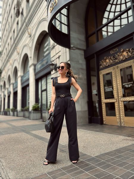 All black monochromatic outfit - my bow tank is only $12! Wearing size XS

Belt is a ferragamo dupe and reversible and under $20 (many diff colors) 

Purse is a Bottega Veneta dupe for under $40 

Pants are size 24 Petite 
