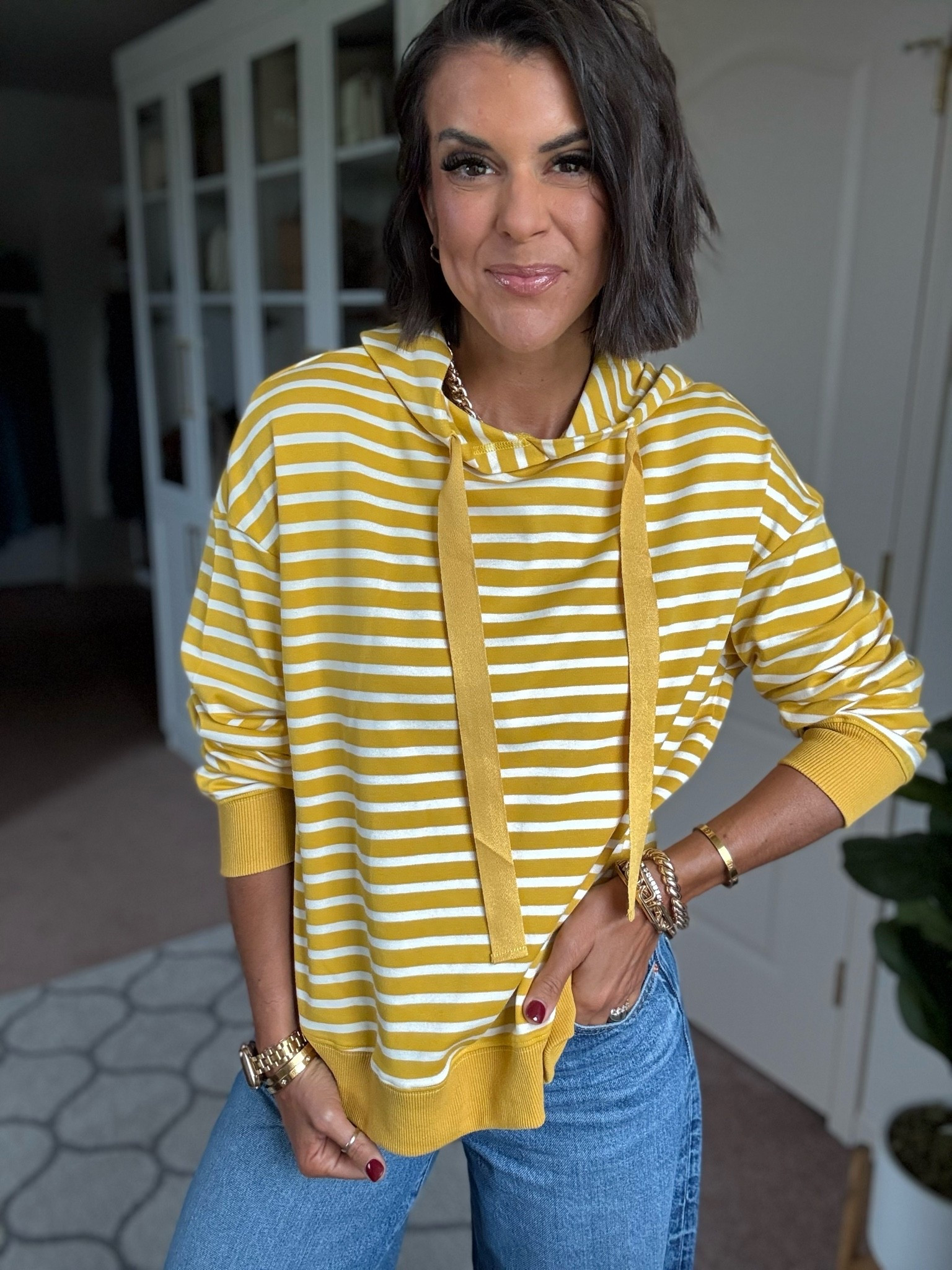 Size small in pullover size 26 in jeans (size down if in between) sneakers fit tts