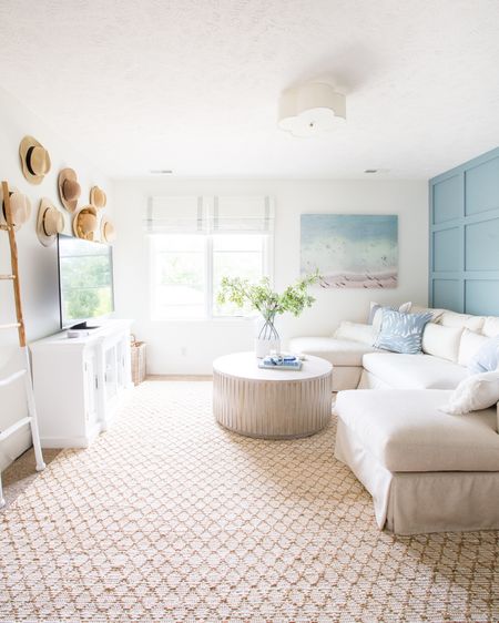 Loved the coastal vibes of the den in our last house. Items include a large beach print, a striped pillow, a palm pillow, a textured lumbar pillow, a colorblock vase with faux greenery and a slip-covered sectional. Additional items include a round wooden coffee table, a jute area rug, a tripod lamp and a scalloped flush mount light. 

simple decor, target threshold, coastal decor, neutral decor, coastal decorating, coastal design, den, family room, living room area rug, pottery barn coffee table, target home décor, den rugs, serena and lily rugs, rugs family room, serena and lily pillows, living room inspiration, game room, media room, wall art, serena and lily, pottery barn sofa, wall decor, coffee table decor, family room decor, amazon finds, target finds, coastal inspiration #ltkfind 

#LTKSeasonal #LTKstyletip #LTKunder50 #LTKunder100 #LTKsalealert #LTKhome #LTKfamily #LTKSeasonal #LTKunder100 #LTKhome