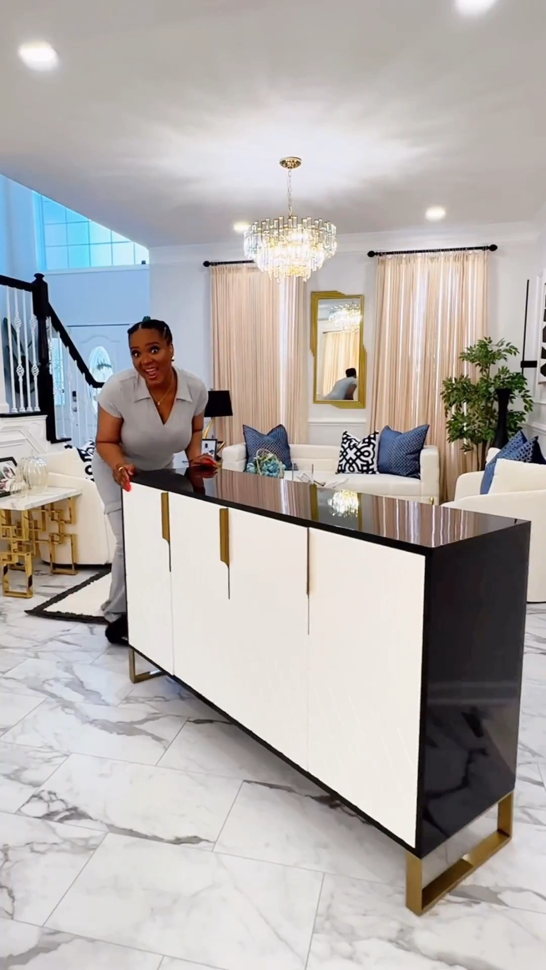 Thinking of elevating an empty wall? Using décor pieces like Wall art, canvas frame, moldings, sconces and even sideboards makes a huge difference.
I love to double my credenza for extra wide walls which helps fill in a lot of the space and give your home an elevated appearance.

#LTKHome #LTKvlog #LTKmomlife