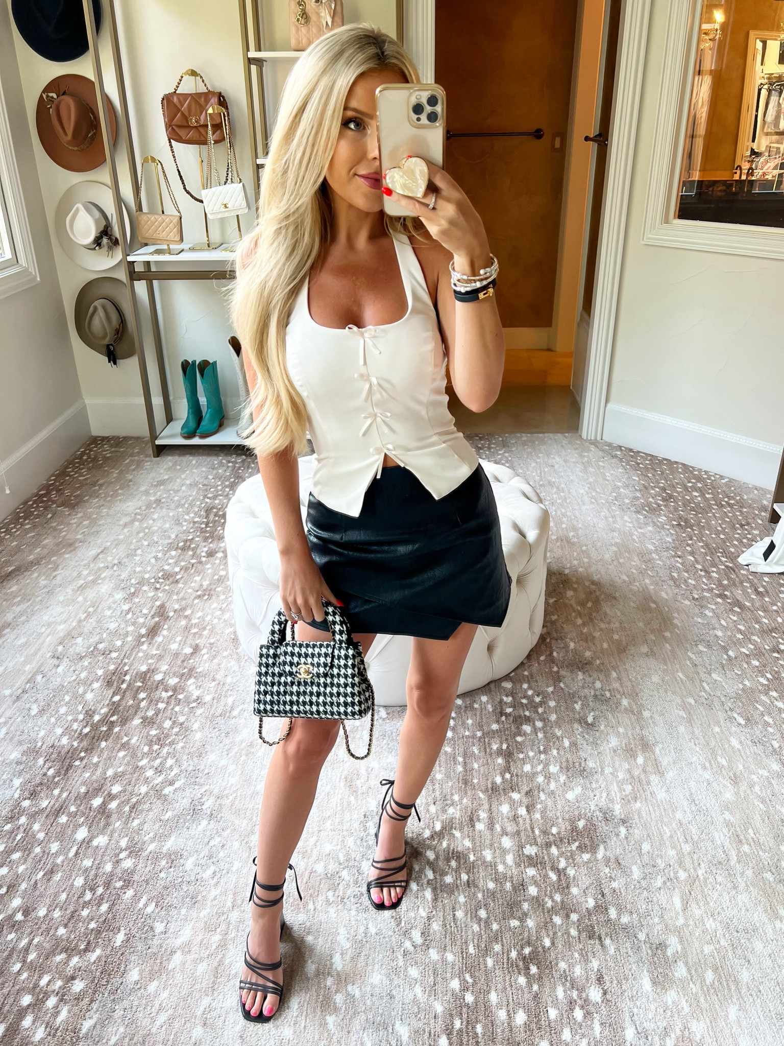 Summer outfit. Lulus. White tank. Bow tank. Leather skort. Black heels 

#LTKstyletip #LTKSeasonal