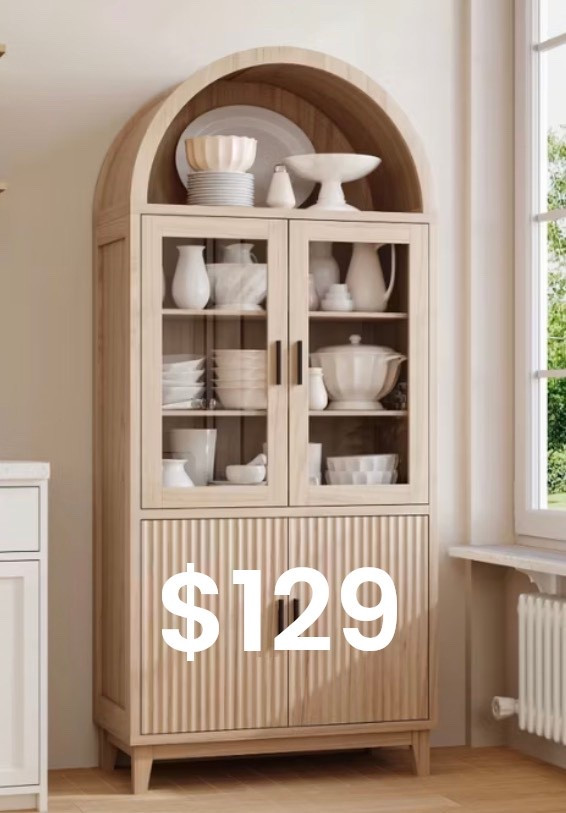 
A serene, light-filled interior featuring a tall arched light-oak cabinet with glass doors and fluted wood detailing on the lower panels. Shelves are styled with layered white ceramics, bowls, and sculptural pottery, creating a calm, curated look. Soft natural daylight streams through a nearby window, highlighting warm wood tones, subtle shadows, and organic textures. Modern European farmhouse aesthetic, quiet luxury styling, timeless design, ultra-realistic editorial interior photography.

⸻

Hashtags (25)

#ArchedCabinet
#NeutralHome
#OrganicModern
#QuietLuxuryHome
#EuropeanInspired
#WarmWoodTones
#TimelessInteriors
#StyledShelves
#NeutralDecor
#MinimalLuxury
#ModernTraditional
#HomeInspo
#InteriorAesthetic
#CalmLiving
#ArchitecturalDetails
#SoftNeutrals
#OrganicTextures
#ElevatedInteriors
#HomeEdit
#ModernFarmhouse
#InteriorStyling
#DesignInspiration
#CozyMinimal
#NaturalMaterials
#EffortlessStyle



#LTKGiftGuide #LTKHoliday #LTKdayinmylife