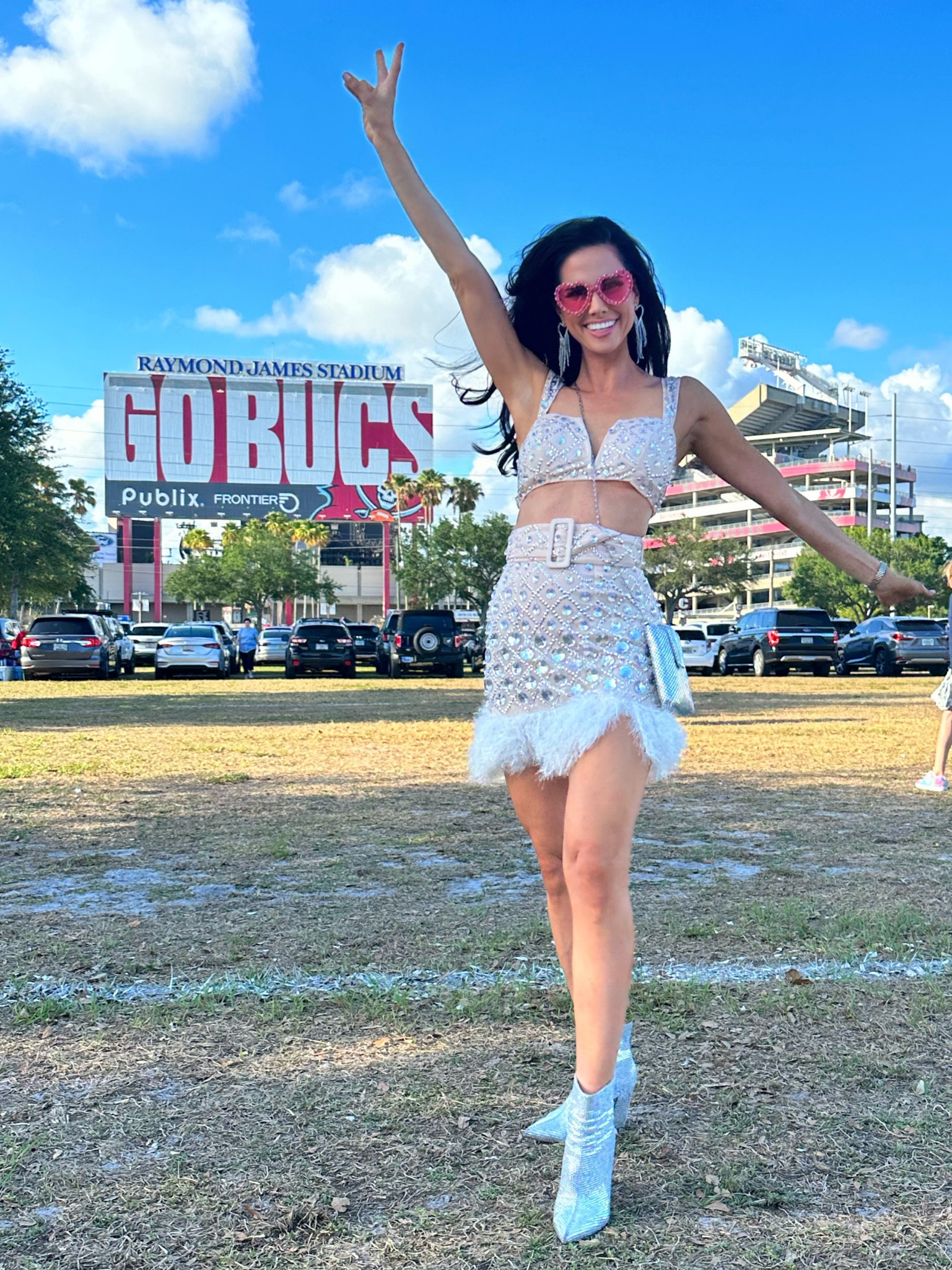 Taylor Swift concert outfit, eras tour outfit, two piece set, rhinestone booties, stadium bag, heart shaped glasses, chandelier earrings, heart shaped earrings 

#LTKFind #LTKFestival #LTKstyletip