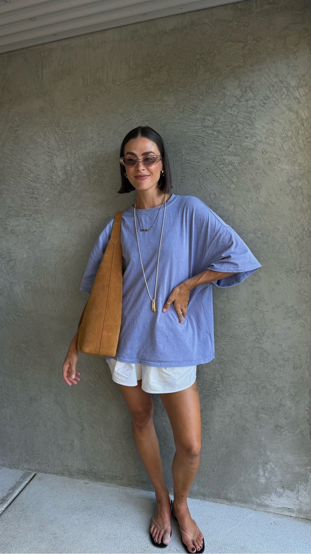 When I don’t know what to wear I always go for my comfort items - a colourful oversized tee with some drawstring cotton shorts. Thongs are a go to and I’ve added some interest with my suede bag, pendant necklace and transparent sunglasses 

#LTKaustralia #LTKstyletip #LTKspring