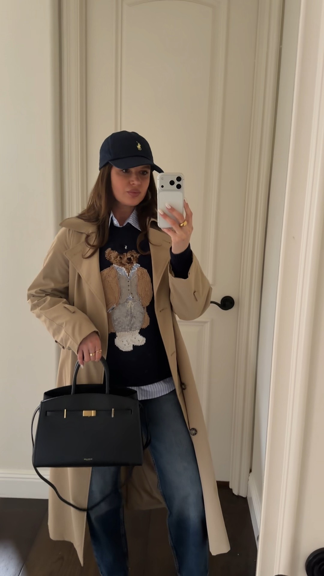 Styling this cute and cosy Ralph Lauren Bear Sweater with straight leg jeans, a trench coat, heeled booties and a classy black DeMellier  tote  #ralphlauren #sweater #cashmere #bearsweater #trenchcoat #coat #cap #booties #tote #black #navyblue #demellier 

#LTKFindsUnder100 #LTKootd #LTKWorkwear

#LTKSeasonal #LTKStyleTip #LTKootd