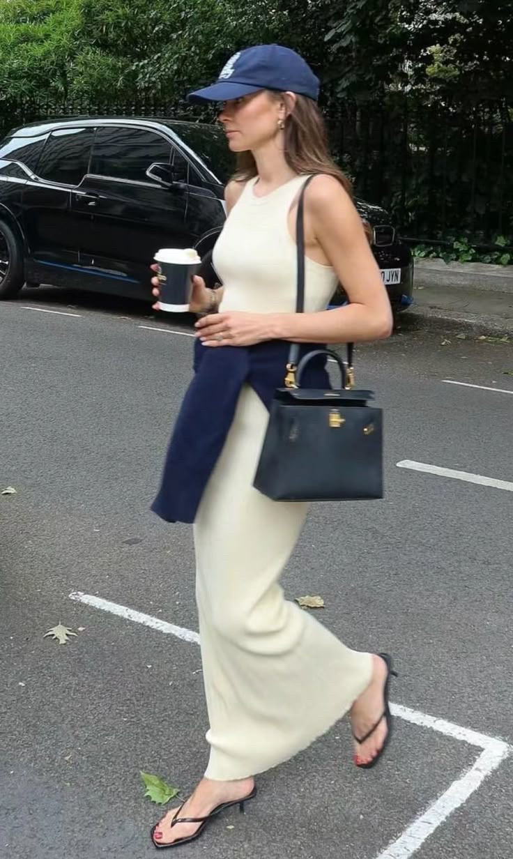 Long ribbed off white dress
Navy sweater 
Black top handle 
Navy cap
Black Tongue kitten heel sandal 

#LTKPetite #LTKSpringSale #LTKStyleTip