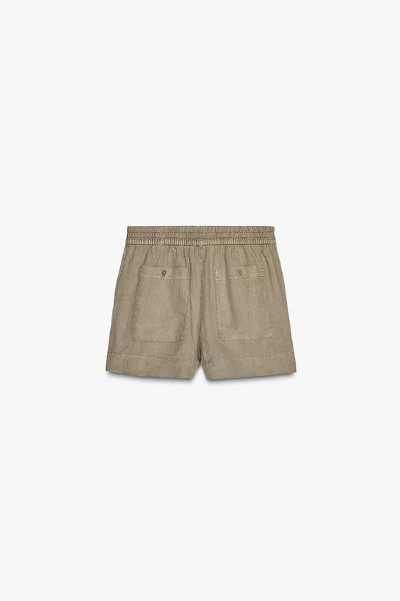 ZARA WOMAN COLLECTION Mid-rise shorts made of 100% linen yarn. Hidden in-seam side pockets and pa... | Zara US
