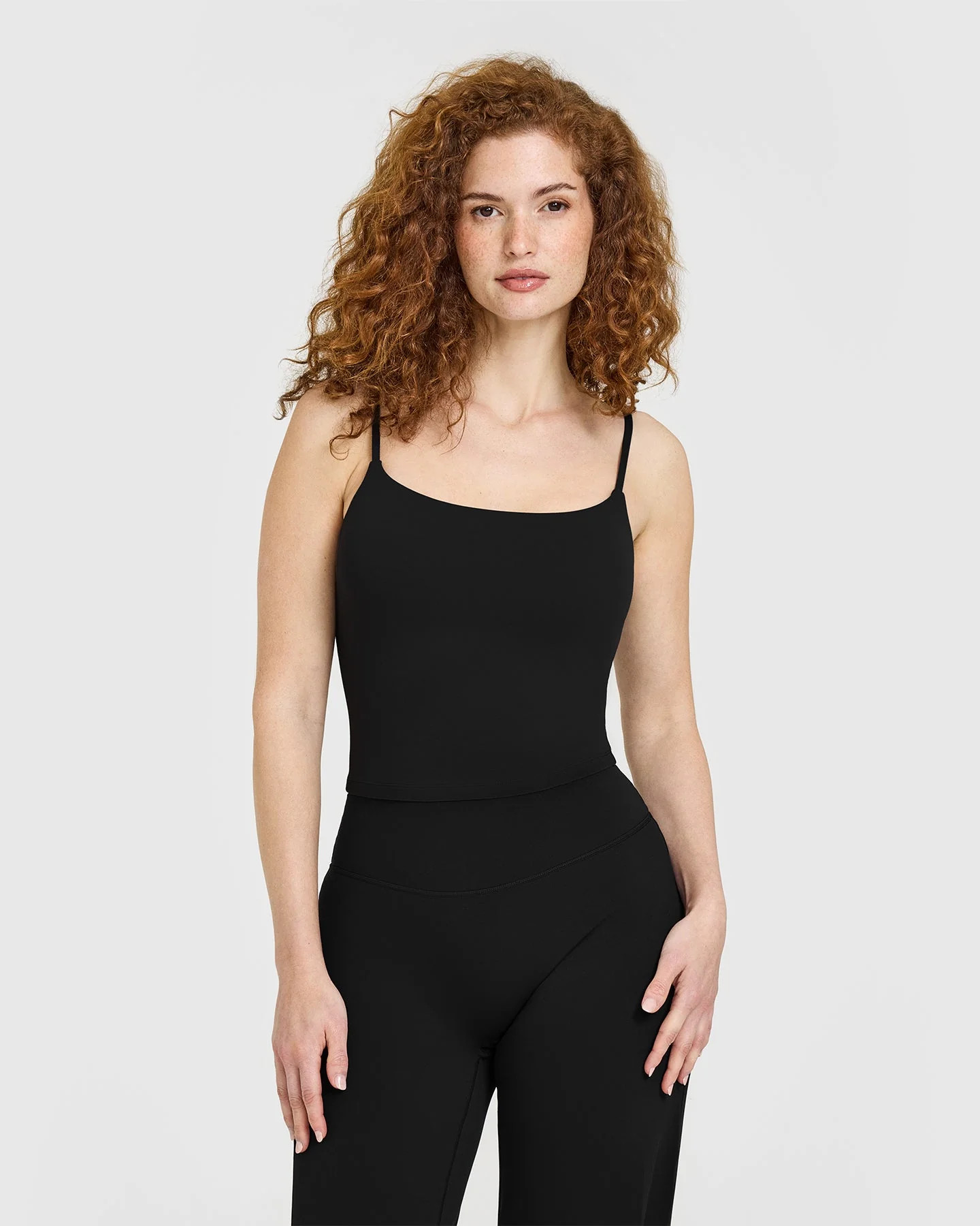 SoftMotion™ Strappy Mid Tank Top with Built in Bra Shelf with White Logo 
 Black | Oner Active (UK / US)