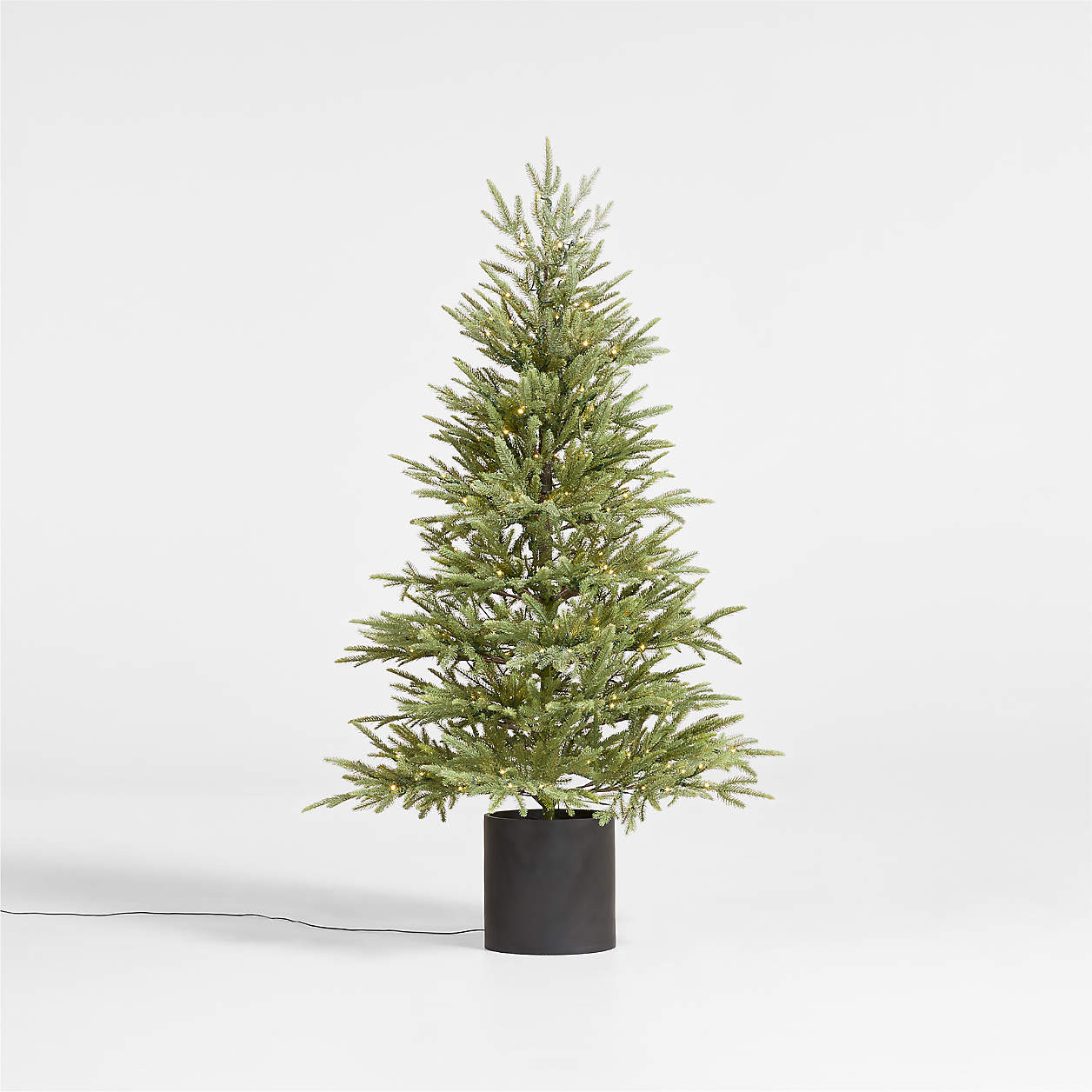Potted Faux Norway Spruce Pre-Lit LED Tree with White Lights 5' + Reviews | Crate & Barrel | Crate & Barrel