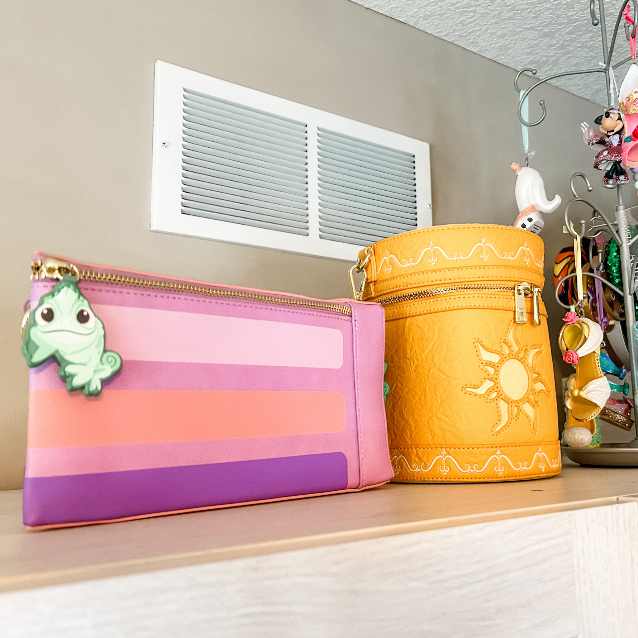Both of the bags on top of the cabinet right now are Rapunzel inspired! 🤩✨💜

#LTKFindsUnder100 #LTKHome #LTKTravel