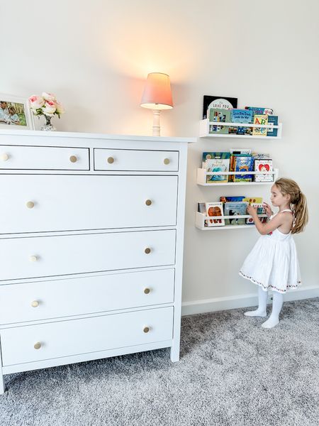 Girl’s bedroom decor: book shelf, books, white dresser, pink lamp

#LTKhome #LTKkids #LTKfamily