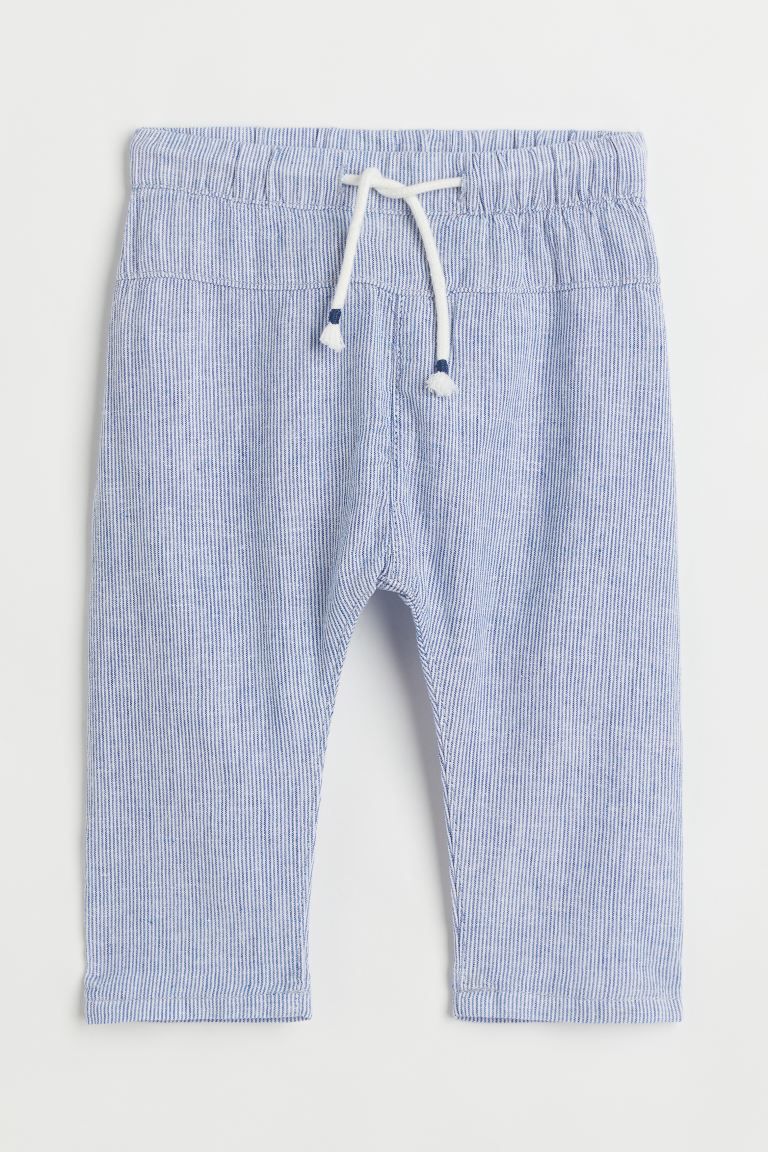 Loose-fit pants in airy woven fabric. Elasticized drawstring waistband, back pocket, and straight... | H&M (US)