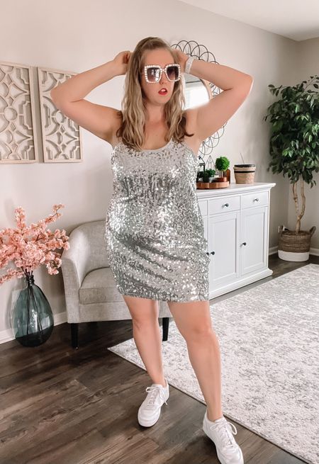 In my You Need to Calm Down era. Silver sequin dress for The Eras Tour Taylor Swift concert. Very comfy and flattering! Could style with cowboy boots or sneakers depending which look you wanted!

Sparkle sequin dress / white tennis shoes / concert outfit / Taylor swift / eras outfits

#LTKcurves #LTKstyletip #LTKunder50