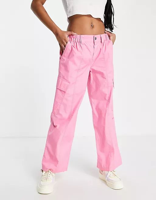 ASOS DESIGN Petite 00s low rise cargo pants in pink | ASOS (Global)