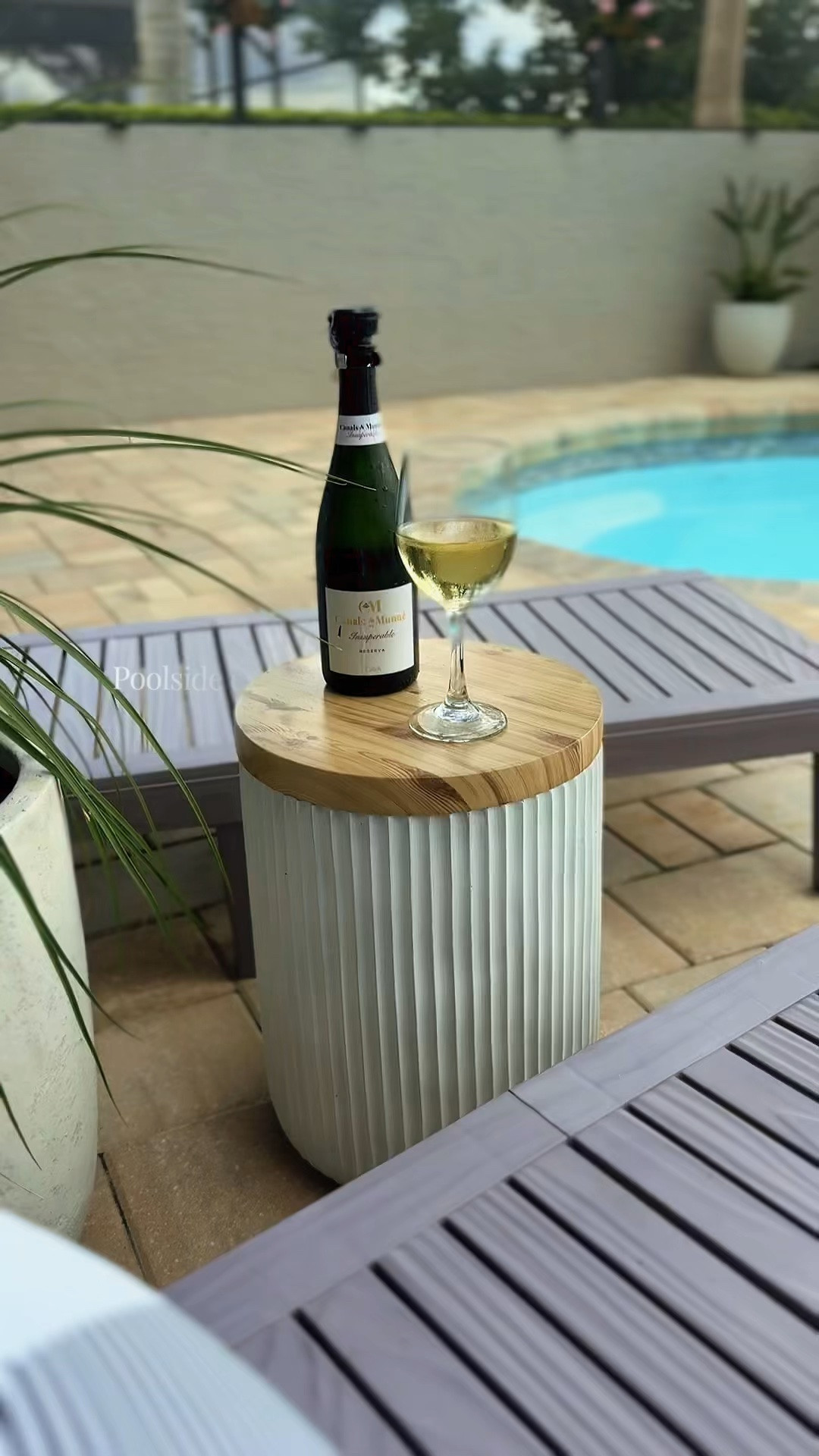 styling season is officially here 🤍 This fluted outdoor side table is one of those pieces that instantly makes your patio feel more elevated and designer-inspired. Neutral, functional, and perfect for summer evenings by the pool 🍷✨ 

#LTKHome #WayfairCreator #OutdoorDecor #PatioStyling #NeutralHomeDecor