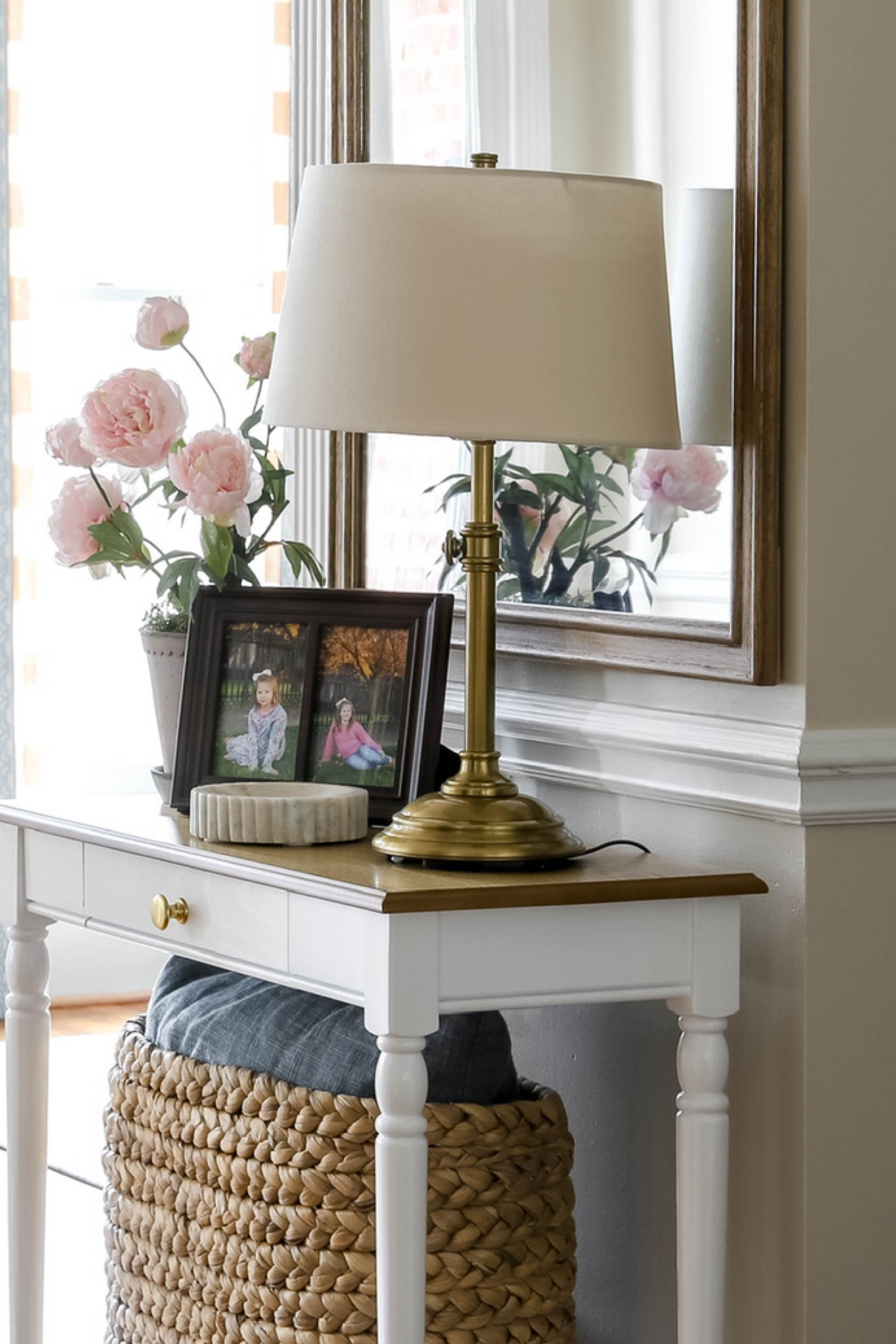 This cute adjustable USB-port table lamp is great for a small entryway table. It comes in bronze or brass finish and two sizes. For height adjustment, just turn the knob.

#LTKHome
