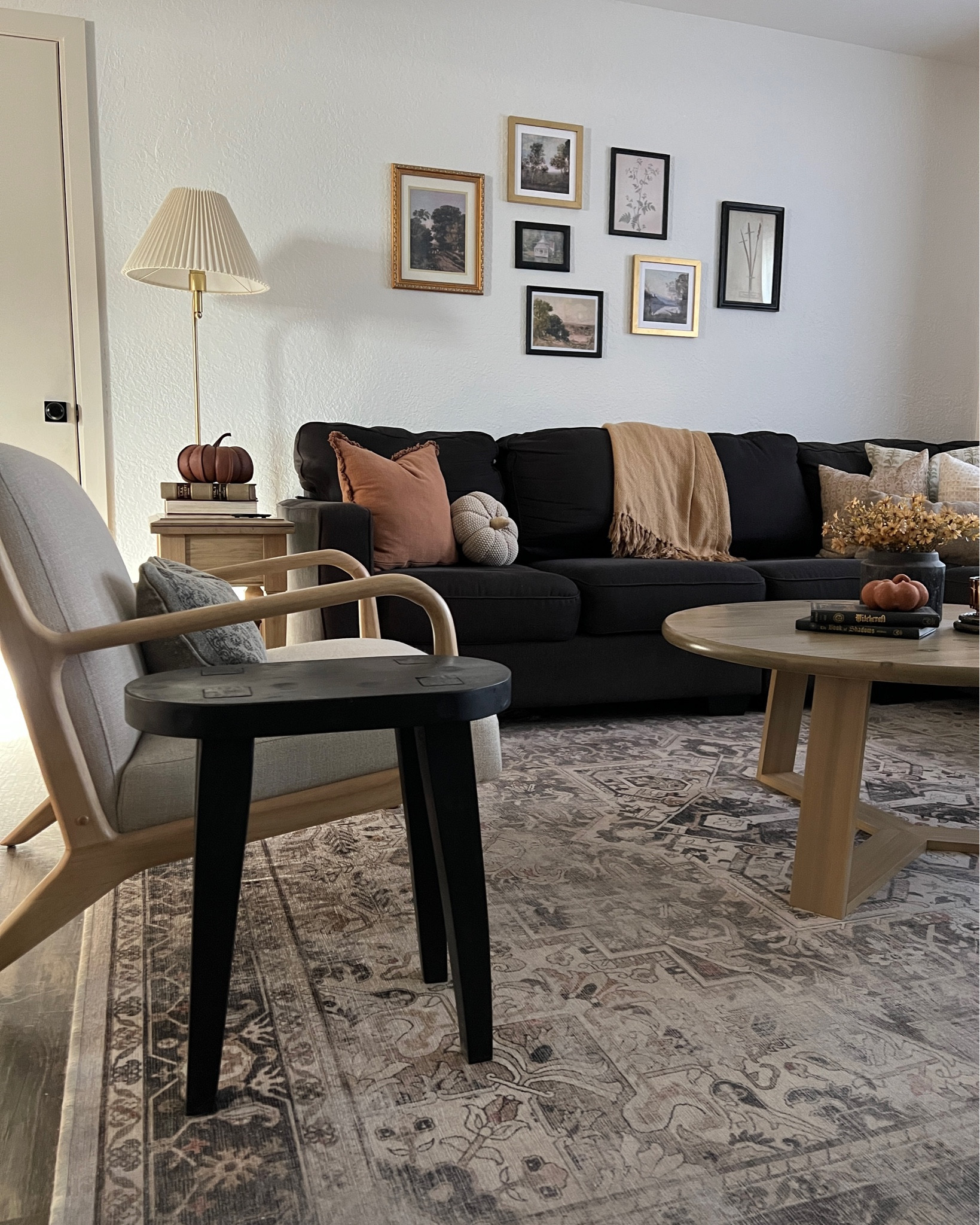 living room dark charcoal black couch sectional coffee table accent chair rug pillows fall autumn seasonal aesthetic cottage vintage neutral transitional home decor design styling interior ideas inspo

#LTKhome #LTKHalloween #LTKSeasonal