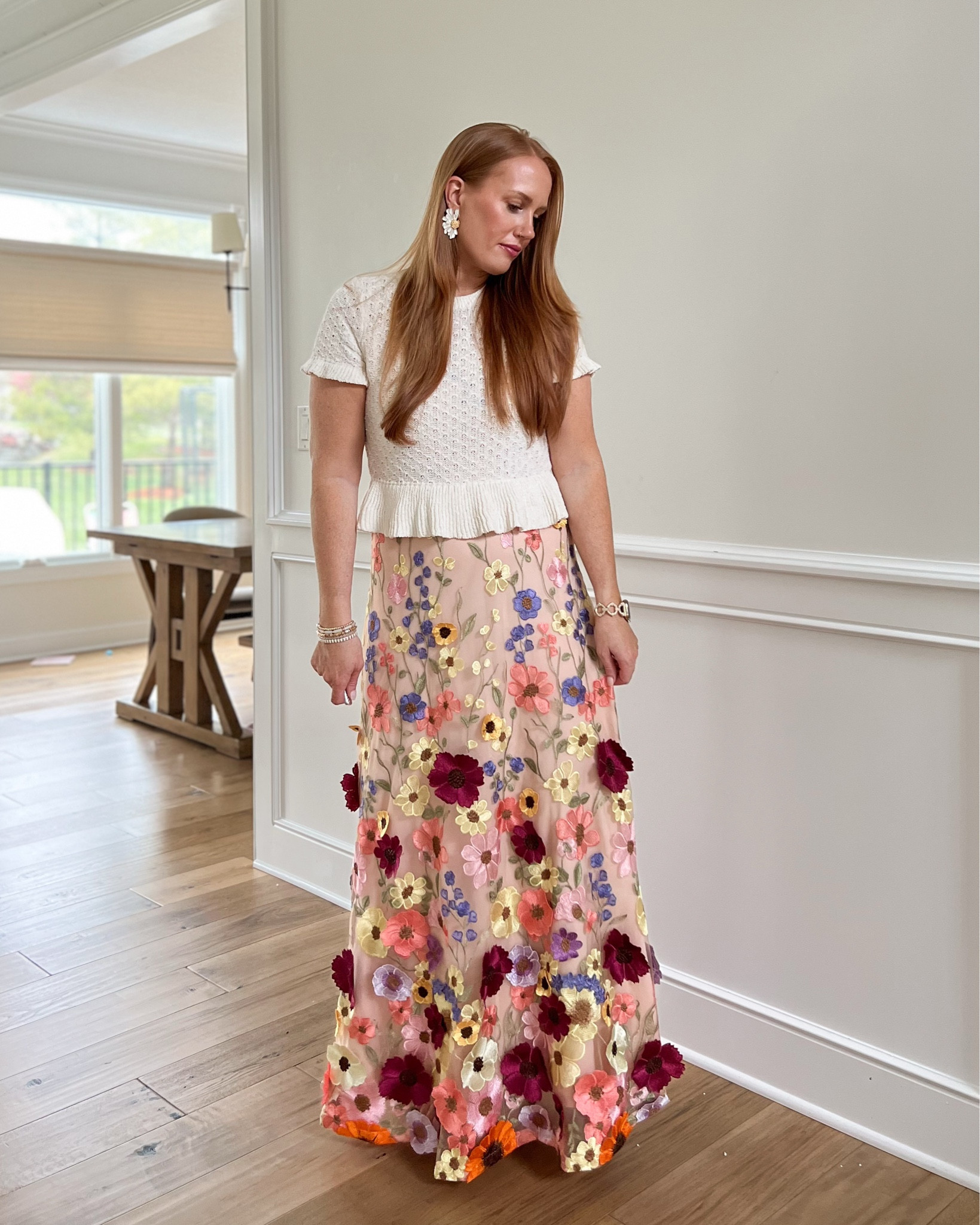 Easter Outfit. I wore this knit peplum cream top over my floral dress from the gala (see previous post) for Easter. Floral spring outfit. Lulus dress. Floral. Cream. 3D embroidered floral dress. Knit peplum top. Cream top. H&M 

#LTKSeasonal #LTKOver40 #LTKStyleTip